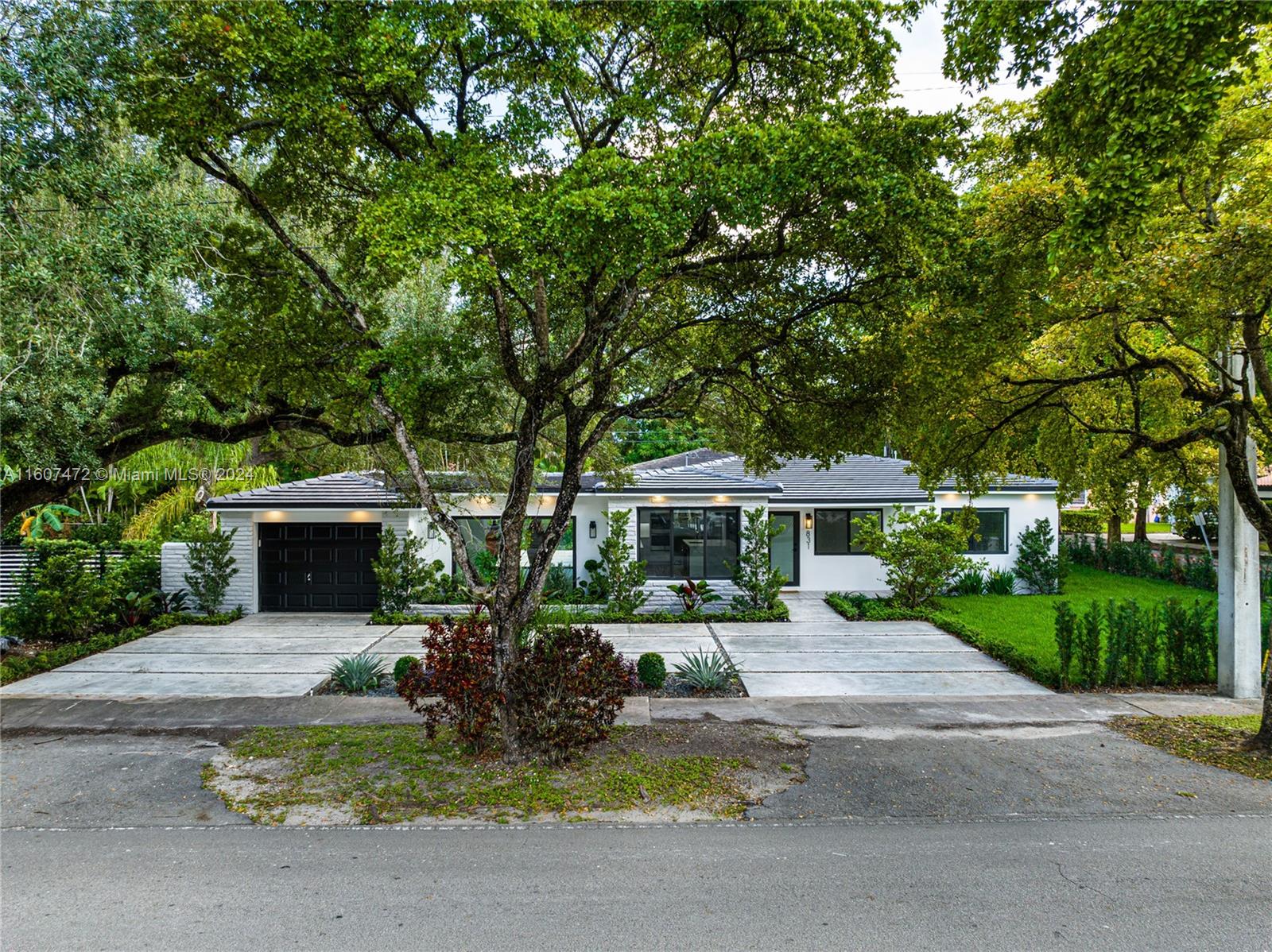 Refined living in a 3-bed, 3-bath North Gables home. Meticulously renovated for comfort, open floor plan, tropical courtyard, and an elegant kitchen with top-tier appliances. Property features both a Junior suite and a primary suite with a lavish bathrooms. Nestled in North Gables, this corner lot home boasts a new driveway and freshly landscaped surroundings, impact windows and doors. Modern lighting adds sophistication to spacious living areas & the gourmet kitchen. The primary suite offers a luxurious retreat, with view to the patio & yard. Benefit from essentially new construction with comprehensive renovations. This is your chance to have a practically brand new construction home in Coral Gables - Schedule your appointment today!