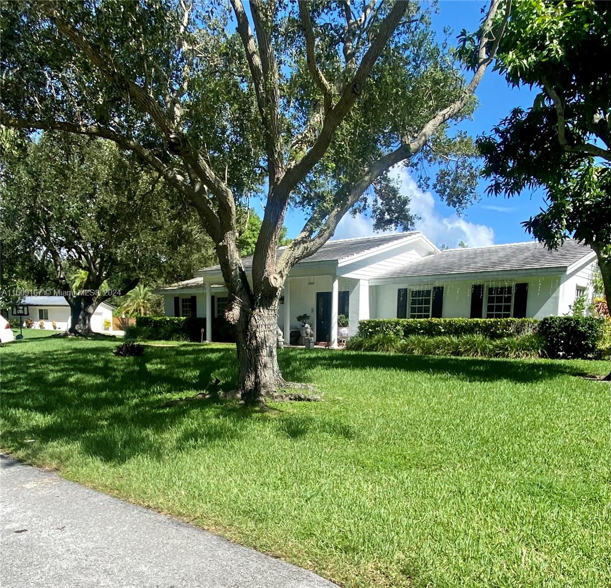 Charming Colonial style corner home , with 4 bedroom and 3 updated bathrooms with master bathroom Jacuzzi with a renovated kitchen with all new appliances , new washer and dryer and ac unit . New roof 2016 This house can have additions if needed , with a large dining room w pool view The lovely roofed terrace is overlooking the pool and the gorgeous lushed garden fully fenced and 2 and a half car garage . This quiet street and amazing neighborhood surrounded with old oaks have all top ratted schools , this house is move in ready . This corner home is part of neighborhood like no other where you will enjoy the best neighbors with anual block party’s , Halloween events, Santa’s runway and much more . The lot sits higher than most homes in the area for a none flood zone .