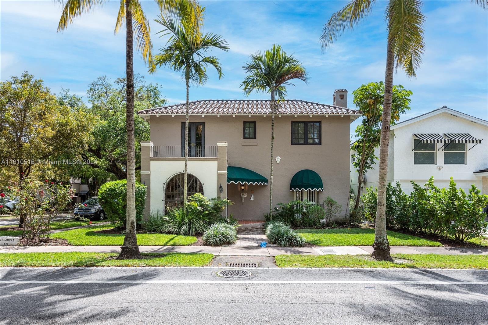 This 1927 home is a Mediterranean Revival home with approx. 2,756 adj. sq. ft. You enter a foyer that leads to a large living room with a fireplace and exposed wood beams on the ceiling. From the living room, is a beautiful dining room, that leads into the kitchen with an eat-in area. The kitchen has been updated to a country style, with a gas stove, 2 refrigerators, and a washer/dryer enclosed in the cabinets. Next is an office with a closet and half bath. Upstairs are four nicely sized bedrooms all with hardwood floors. There are two baths and the closets are very generously sized and updated. Impact windows and hurricane panels. The roof is from 2010. The house is on a 5,000 sq. ft. lot with a 2-car garage and on public sewer, within walking distance to DT Coral Gables.