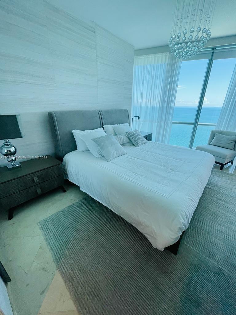Enjoy the serenity and breathtaking views from this 2 bedroom plus den residence located inside the magnificent 52 story all glass high rise designed by award- winning architect Carlos Ott. Direct Ocean views.