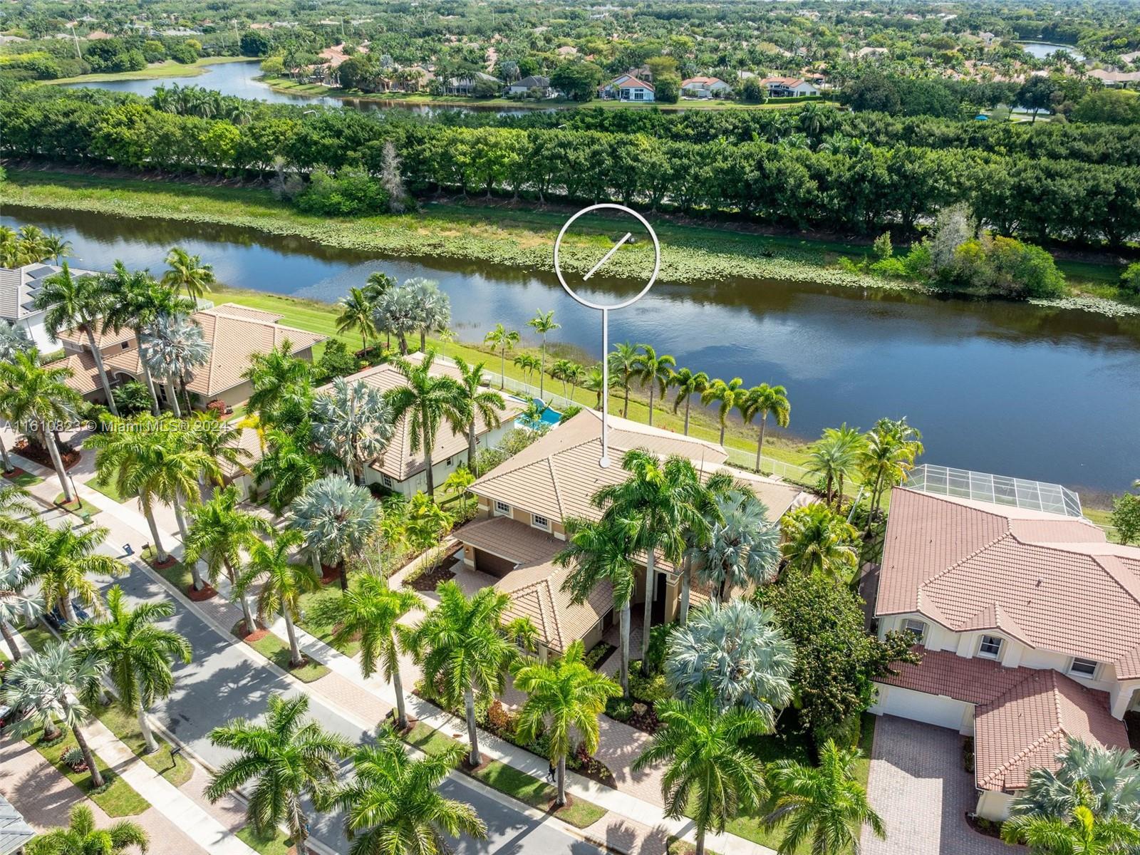 Highly sought after Sanibel model in Weston Hills Country Club. This spacious home boasts 5,365sf of living space on a 15,453sf waterfront lot. With 5 bedrooms, 5.5 bathrooms, plus an office/bonus room with wet bar/loft, this property offers ample space for comfortable living. The home features a 3-car garage, separate in-law suite with an independent entrance, and Accordian shutters for added convenience and security. The backyard is perfect for entertaining, w/ a newly renovated salt water heated pool, summer kitchen & spacious outdoor area. Inside, you'll find Saturnia marble on the 1st floor, custom moldings, & millwork throughout, adding a touch of elegance to the space. The open kitchen is equipped with granite countertops, walk-in pantry & all the top appliances.