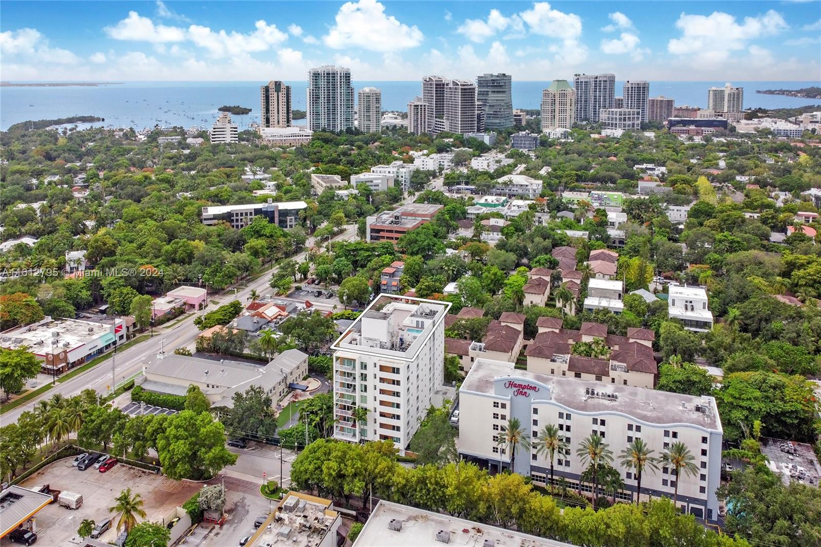 Boutique oasis in Coconut Grove, a true 1 bed 1 bath condo with polished concrete floors, plantation shutters with impact windows & a large well-appointed kitchen with granite counter tops, recessed lighting, & Carrera marble backsplash & an excellent counter ideal for entertaining. Newer washer and dryer inside unit for added convenience. Plus a unique roof top spa pool with sun lounge area enjoying panoramic skyline views of the Grove, Downtown Miami Skyline, & Biscayne Bay. Onsite well-equipped gym. Underground covered assigned parking. Pet friendly building. Excellent location, huge walkability minutes to the Village/ CocoWalk and the new Grove Station Shops & Metro, full of restaurants & shops.