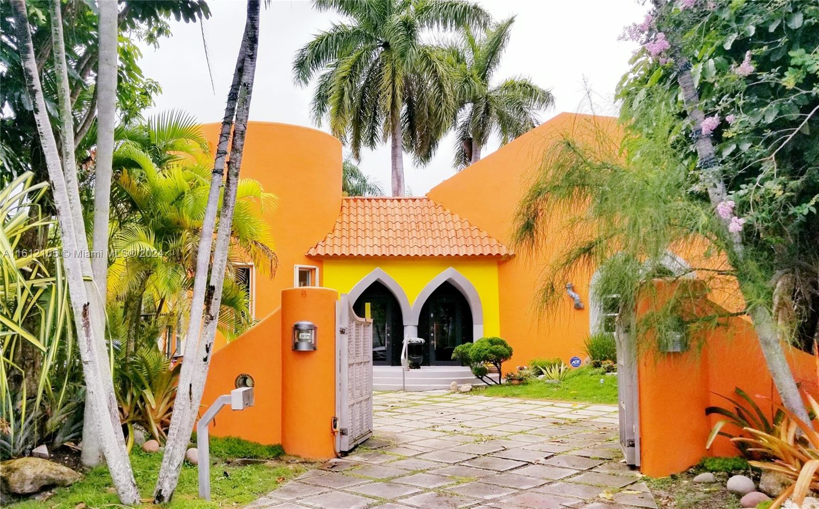 Nestled in the heart of South Miami, this Mediterranean gem is a true architectural masterpiece designed by  architect  Jose Anthony Enriquez. This one-of-a-kind home stands out in the community with its unique design and exquisite craftsmanship. Every door is hand-made from wood, adding a touch of artisanal elegance. The grand vaulted ceilings are adorned with hand-stamped wood beam accents, evoking the grandeur of a majestic palace. The polished cement flooring throughout enhances the home's modern yet timeless appeal. This home is not just a place to live, but a work of art that exudes luxury and sophistication.