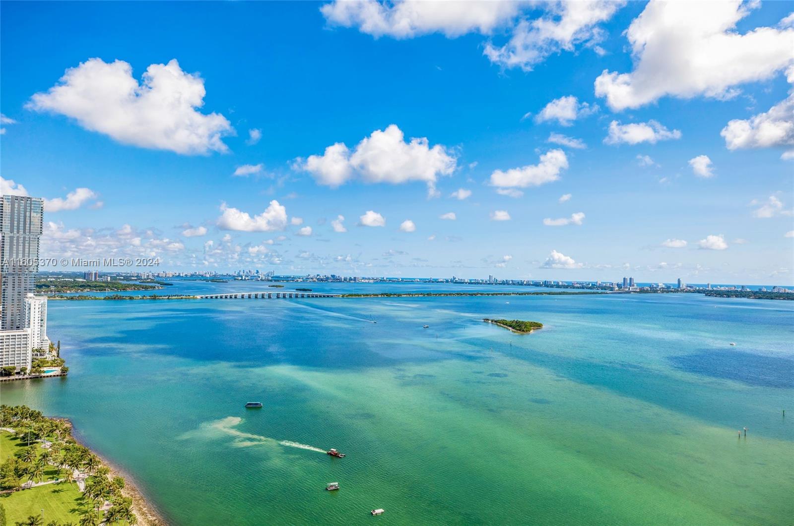 Experience the pinnacle of waterfront living in the fully renovated unit at The Grand, boasting the building's finest views. This spacious two-bedroom with den unit offers unobstructed vistas of Biscayne Bay and Miami Beach, complemented by new impact-resistant windows and doors, and sleek modern bathrooms. Its prime location is near Miami Beach, Brickell, Downtown, Wynwood, and The Design District, with new dining spots like Klaw and Casadonna just a short distance away. The Grand features a plethora of dining and shopping options right in the lobby, along with round-the-clock concierge, valet, and security services.