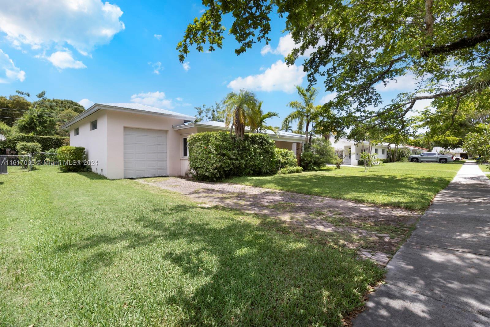 Fantastic opportunity on a highly desirable South Miami street in a quiet location and central to all.  Cute, well-maintained, and updated in key places 3/2 with nice open living spaces including a classic Florida family room.  Impact glass windows and doors, metal roof, porcelain floors, indoor laundry room, and more.  Endless possibilities with this one- great house to live in, renovate, expand, and/or develop.  Large elongated 1-car garage with plenty of storage and split bedroom plan.  Great schools and minutes away from South Miami, Pinecrest, and the Gables.