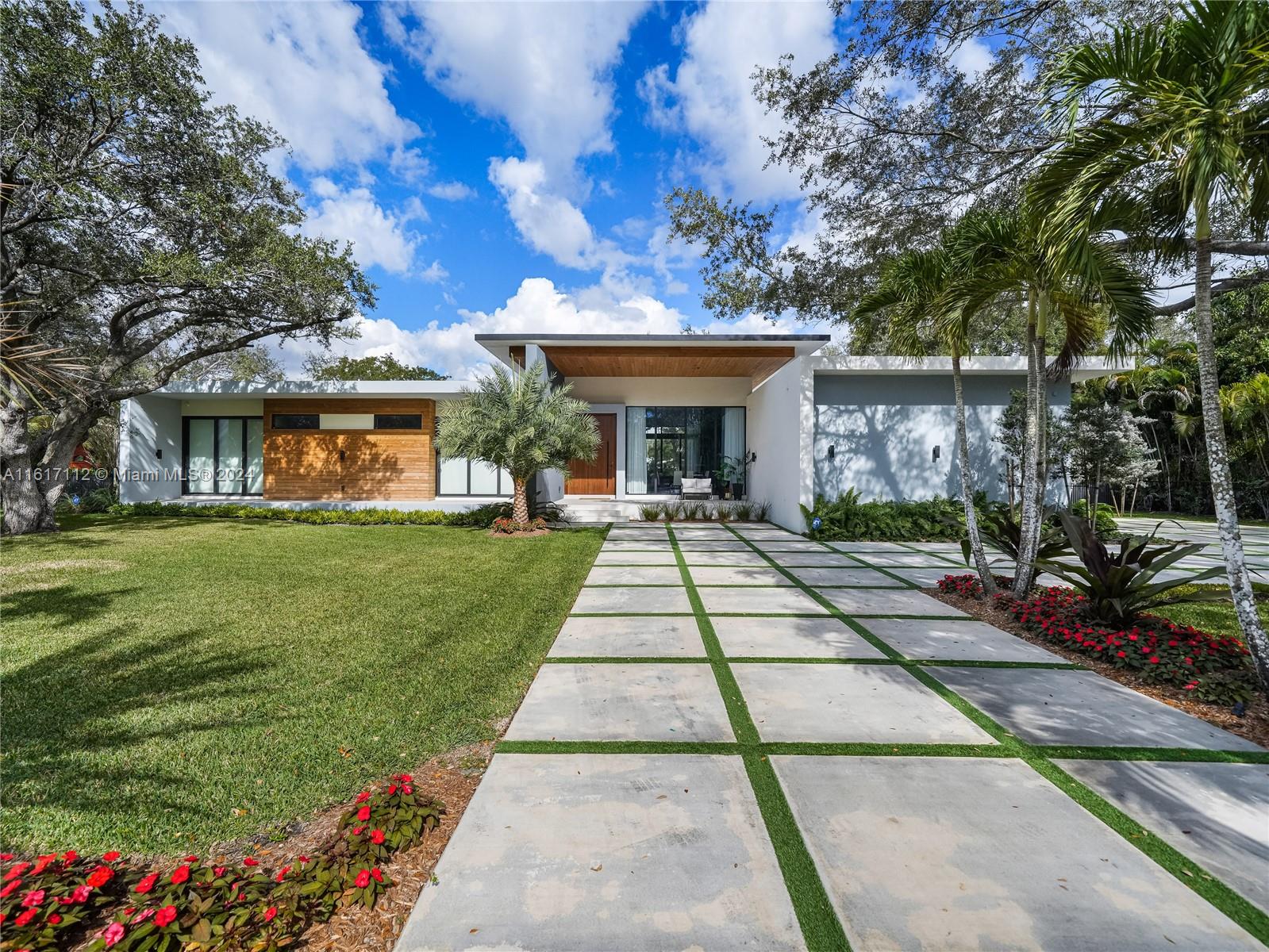 Beautiful Modern Construction in the Heart of Pinecrest. This spectacular home includes: 5 bedrooms, 5.5 bathrooms in the main house with a 1/1/ guest house, fully gated and sits on a 38,766 sqft lot. The main entrance greets you with an 11ft hurricane proof Mahogany pivot door and the throughout the home you have high ceilings ranging from 10 to 14 ft. Fully equipped with Italkraft kitchen cabinets, quartz counters and Miele, Wolf and Liebherr appliances. All bedrooms are fully ensuite and are completed with Mia Cucina closets.