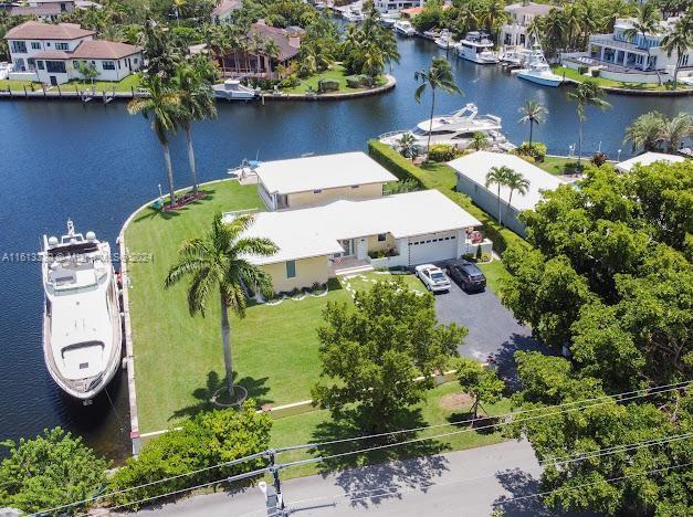 Experience luxurious living in this stunning oversized corner lot with direct ocean access located in the prestigious gated community of Gables by the Sea. This 2-story home features a private boat dock accommodating up to two 75 ft boats and two 32 ft boats. Enjoy mesmerizing sunsets, sunrises, and dolphins passing by from the spacious backyard, perfect for entertaining with its ample patio space. The property includes 4 bedrooms, 2.5 bathrooms, and a 3-car garage, and has been thoughtfully designed and fully renovated less than a year ago with modern stainless steel appliances, impact windows, an emergency generator, and brand new air conditioning. The sizable driveway fits 4+ cars. Additionally, it offers easy access to Lugo Point and is surrounded by top-rated schools.