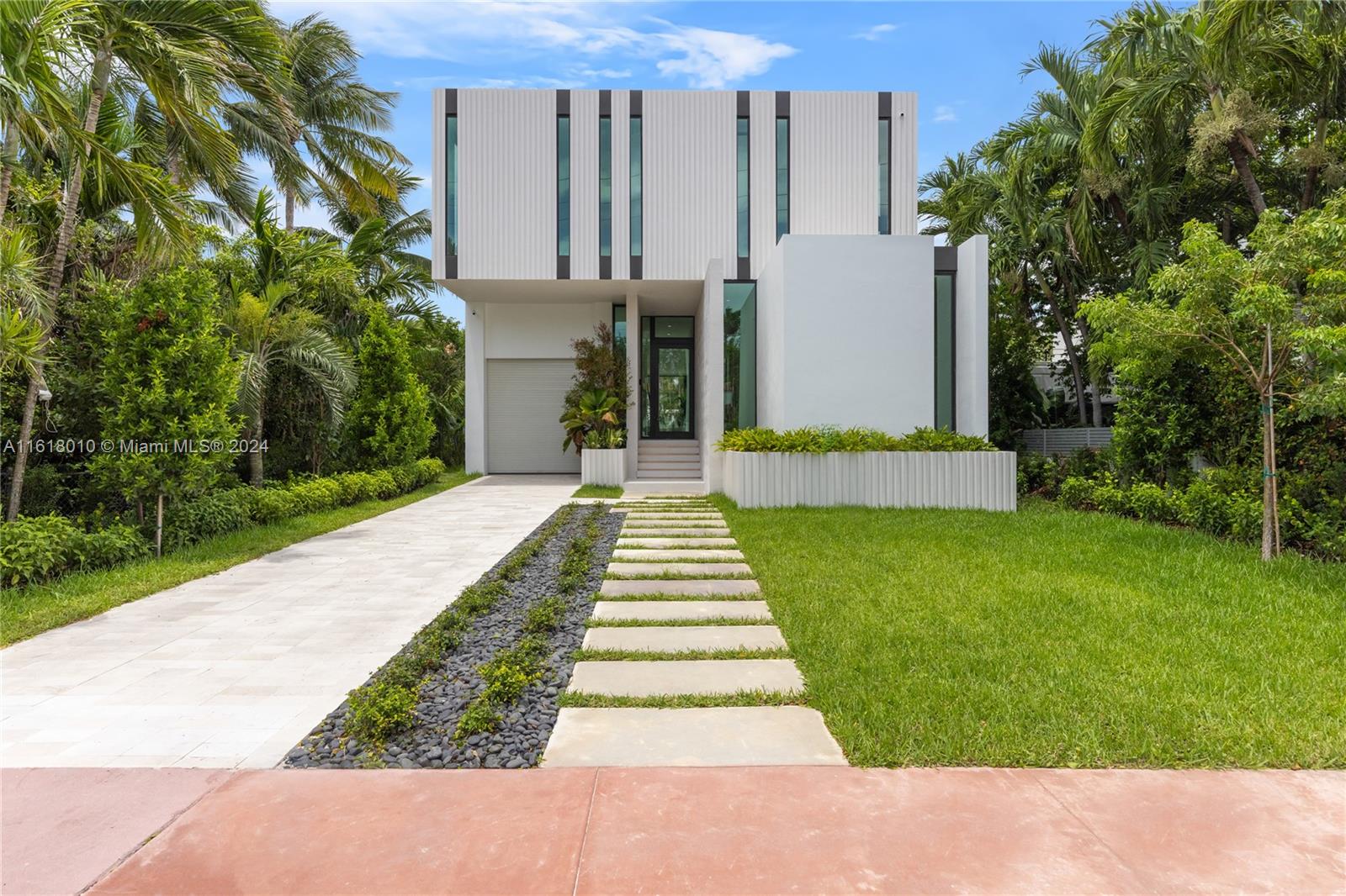 Situated in the heart of Miami Beach, this brand new modern residence spans 3,990 square feet and offers 5 bedrooms and 6 bathrooms. The property features a charming courtyard, expansive terraces, and an elegant marble staircases leading to the second floor. The upper-level master suite includes spacious walk-in closets, while a convenient downstairs bedroom with a full bathroom is perfect for guests or a home office. Outside, you'll find a delightful pool area complete with a summer kitchen, ideal for both relaxation and entertaining. The home's design emphasizes efficiency and striking architectural elements, seamlessly blending sophistication with functionality.