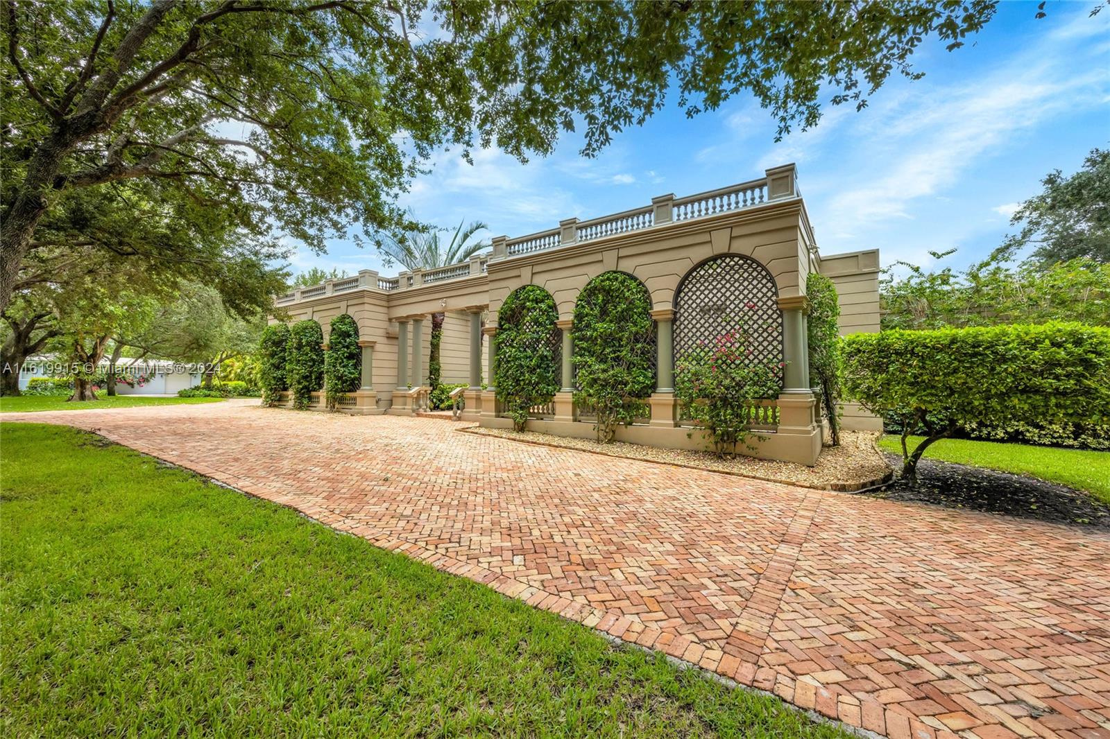 Stately & elegant, this Coral Gables grande dame spans 6,439 square feet on a stunning, lush 30,000 square foot lot.  The 5 BR, 5.5 BA residence features a wide gallery that opens into the spacious formal living room w/ fireplace, formal dining room large enough to host a banquet, & family room w/ built-in bar & access to the pool & patio area.  The eat-in kitchen has solid wood cabinetry, gas range, & sits adjacent to the oversized laundry rm.  Each of the en-suite BRs is very spacious, and the primary suite is extraordinary w/ room for a seating area, massive walk-in closet, & large bathrm. Outside, find a lovely summer kitchen, salt water pool, & full-house generator.  There are impact glass windows & doors, beautiful wood & marble flooring, 2 car gar, all in the heart of the Gables.