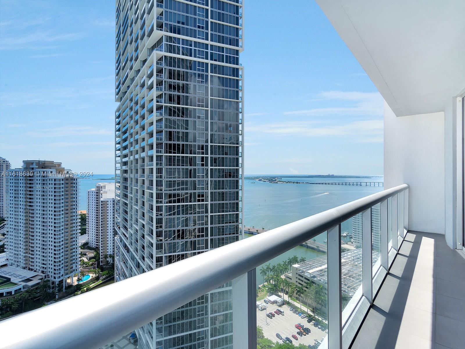 Experience luxurious living in this furnished 1-bedroom condo at Icon Brickell, offering stunning bay and river views. This modern unit features an open-concept living area with floor-to-ceiling windows, a state-of-the-art kitchen with Sub-Zero and Wolf appliances, and a spacious bedroom with balcony access. Enjoy the unparalleled amenities designed by Philippe Starck, including a two-acre pool terrace with three infinity-edge pools, a 28,000-square-foot spa and fitness center, and multiple on-site dining options like Cipriani and Cantina La Veinte. This condo combines urban convenience with resort-style living and is minutes from Brickell City Centre and Mary Brickell Village. Basic cable and internet are included in the rent.