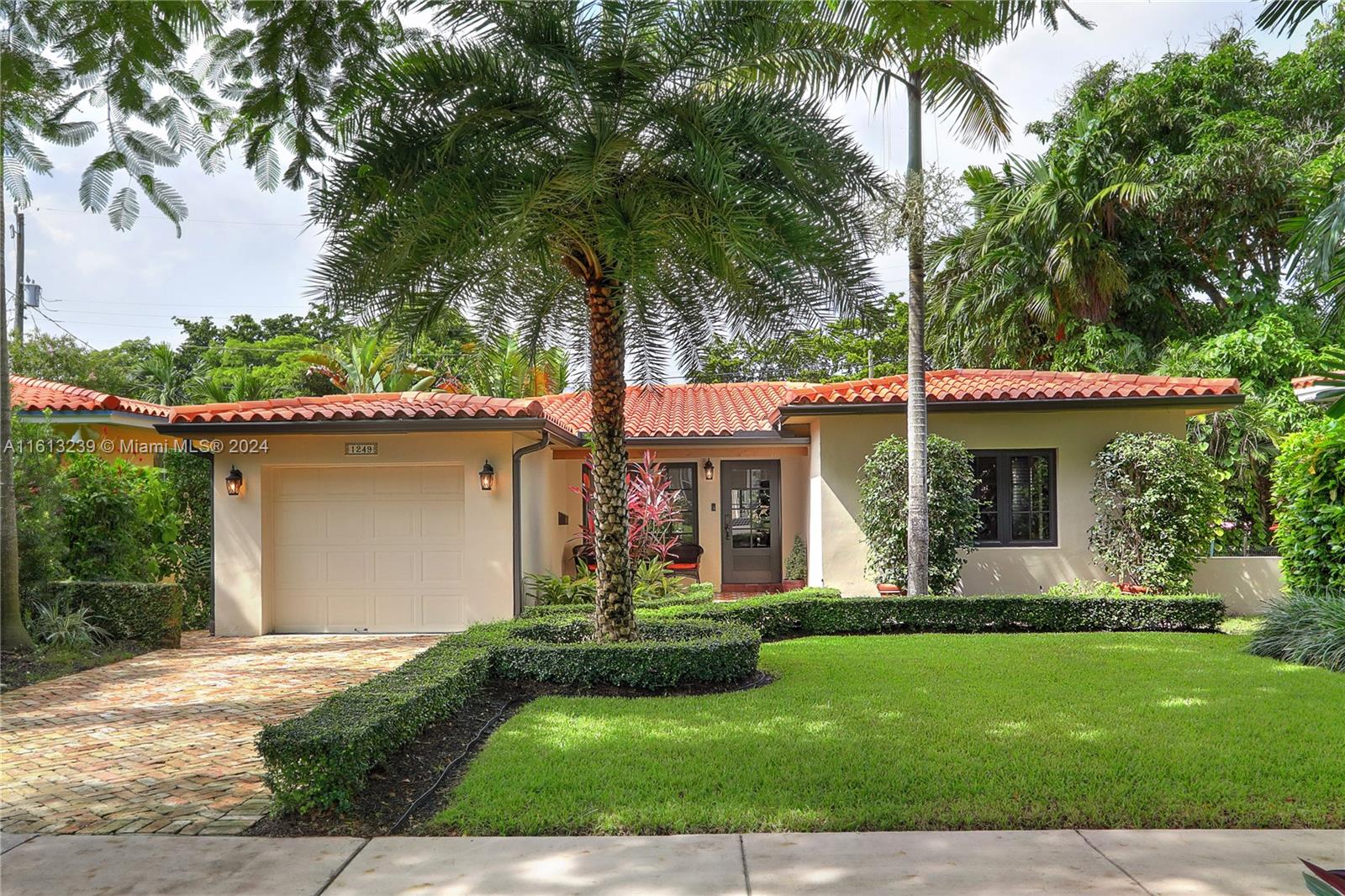 Located on a quiet, beautiful tree-lined street in North Gables, this home was recently remodeled to perfection with a bright open floor plan, boasting gorgeous wood flooring, stunning kitchen with marble counters and high-end appliances. Featuring 3 well proportioned bedrooms with ample closet space and 2 remodeled baths, the home has been meticulously maintained inside and out. Lush landscaping in the front and a mature privacy hedge in the backyard create a private, sunny oasis. Additional features are full impact windows/doors, curtains/blinds on all windows, security system, upscale pendant lighting and 1 car attached garage. Only minutes to downtown Coral Gables and airport.