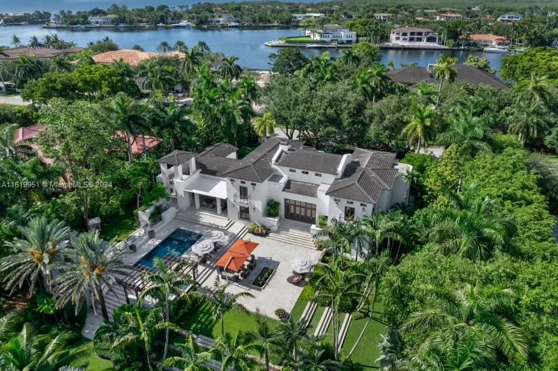 The only turnkey property in Gables Estate below $50M. 555 Arvida is an incredible investment in the most desirable zip code in the world. This exquisitely crafted Mediterranean compound boasts breathtaking views and direct ocean access. The double height, chic living space flows to an executive office, billiard room with salt water aquarium, 5000-bottle wine cellar, grand dining room, gourmet kitchen. The opulent primary suite boasts a spa-like oasis. 3 additional bedrooms and 2 staff quarters offer comfort and convenience. Entertainment options abound w/ media room, gym, outdoor covered terrace spaces, infinity-edge pool, summer kitchen, private 100’ dock (180’ water frontage). Gables Estates’ residents enjoy privacy, security and world-class amenities including Tennis Club.