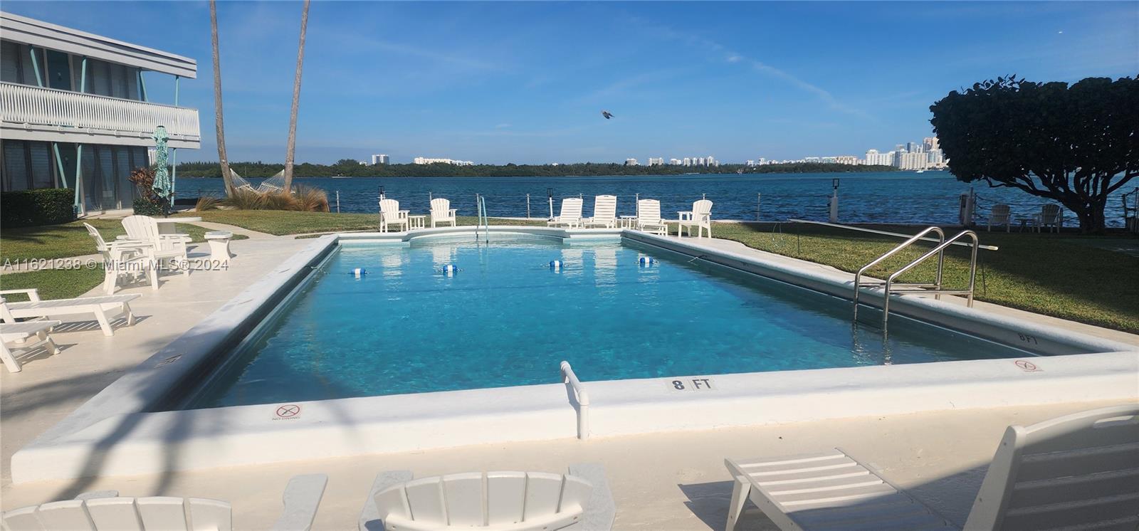 A price to Brag about! Waterfront living awaits in this spacious 2-bedroom Bay Harbor Islands Co-Op! This is your chance to enjoy an island lifestyle at an incredible value. Wake up to breathtaking bay views and enjoy evenings by the sparkling pool. This bright and airy 2-bedroom, 2-bathroom unit boasts 750 square feet of living space and is move-in ready. While the stunning water views will take your breath away, please note the tasteful furniture is NOT included but can be negotiated separately. The building offers lush landscaping, a bayfront swimming pool, a BBQ area, storage, assigned parking, and is in close proximity to Bal Harbour Shops and the beach. Cash-only purchase, no rentals allowed. This won't last long! Inquire today! Cash-only purchase, no rentals allowed.