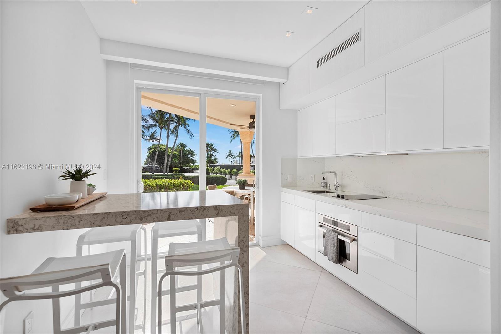 Live the Fisher Island lifestyle in this charming Seaside Villa ground floor unit overlooking beautiful views of the pool and ocean. The unit has been completely renovated. Offered fully furnished, available short and long term. Easy to show!
