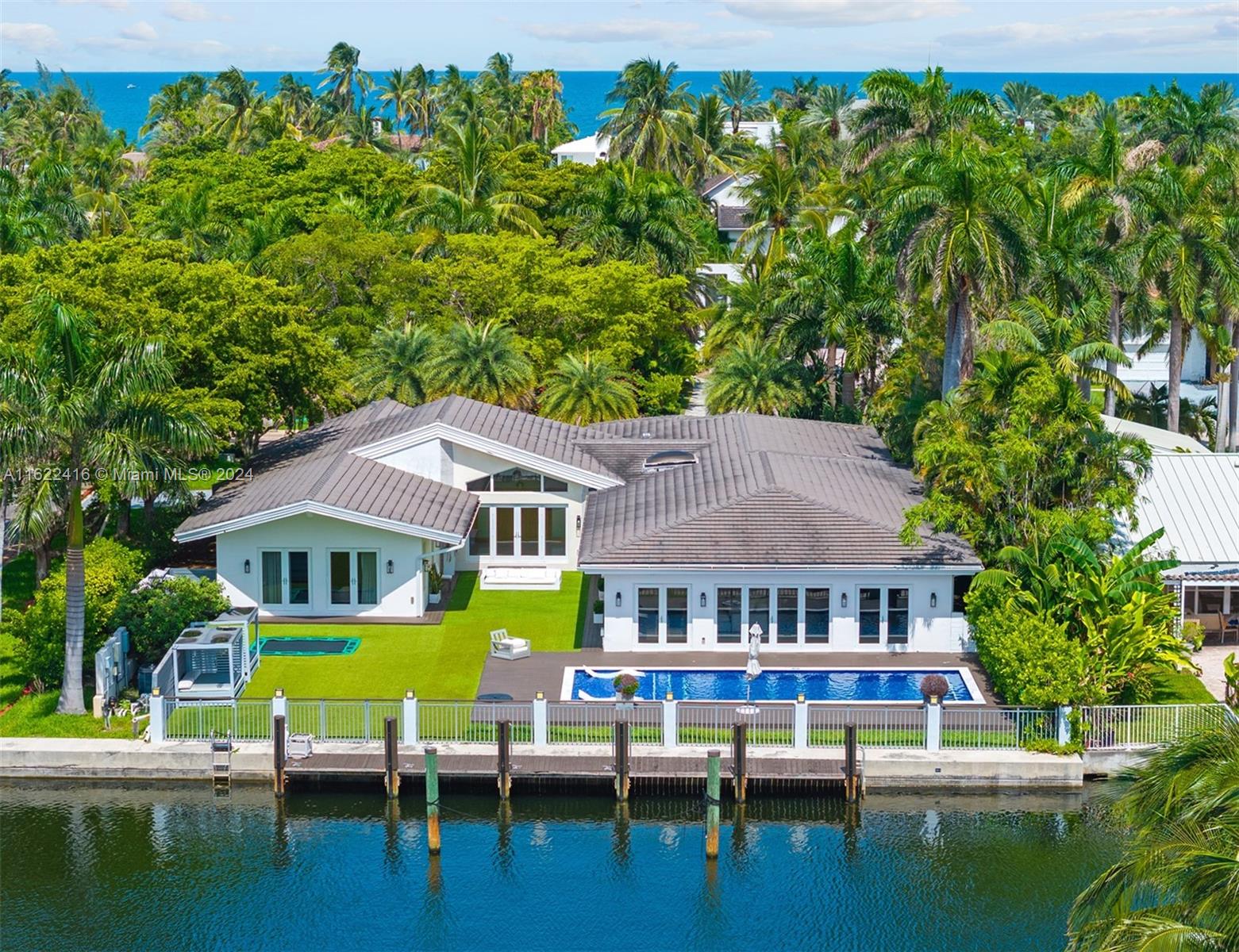 Discover your dream home at 194 Golden Beach Dr, nestled in the prestigious Golden Beach, FL. This turnkey residence epitomizes luxury living with 100’ of waterfront access, ideal for boaters looking to dock a large yacht. Spanning 17,500 SF, the property boasts 6 bedrooms, 5.5 bathrooms, and an office space, ensuring ample room for living and entertaining. The property is a corner lot with a wide driveway allowing to park many cars and it additionally has a 2-car garage. Enjoy the best of coastal living with exclusive walking distance access to a private beach, parks, and sports courts, all within Miami-Dade County's finest residential community. This is more than a home—it’s a lifestyle redefined.