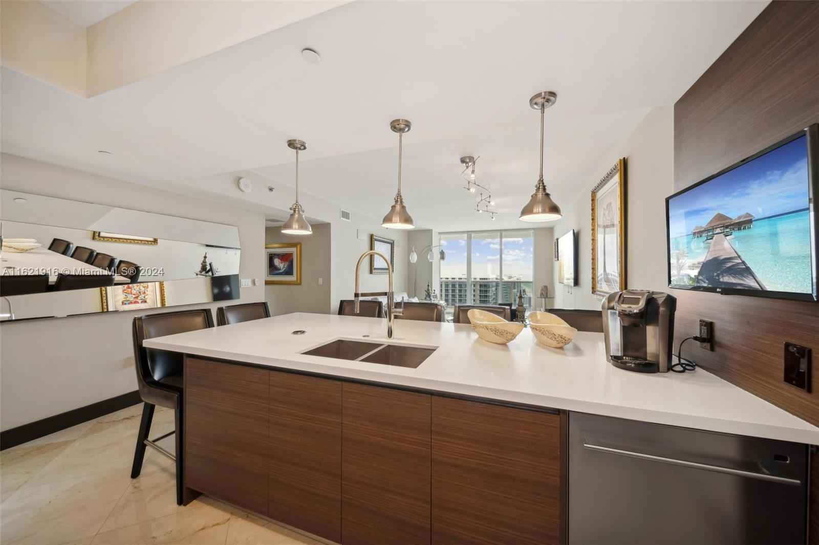 Presenting a truly unique, professionally decorated NE unit Model J, offering 3 bedrooms and 2 bathrooms 1,554 sq. ft. plus a 264 sq. ft. balcony. Never rented before, this 49th-floor Lower Penthouse features spectacular ocean and Intracoastal views, marble flooring, wood doors, remote-controlled custom lighting, built-in closets, and a European-style kitchen with Subzero appliances and quartz countertops. Enjoy 5-star resort-like amenities: a grand 2-story lobby, full-time concierge and security, 24-hour valet, multi-level covered parking, 5 heated pools, a 50,000 sq. ft. spa, and a fitness center overlooking the Atlantic Ocean. Furniture negotiable.