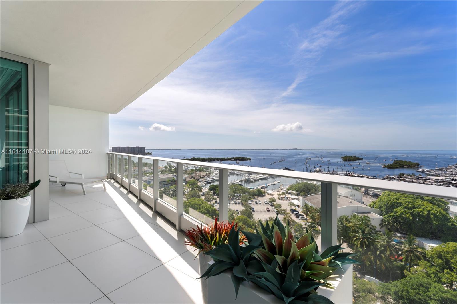 This exquisite luxury condo located in the Grovenor House and the heart of Coconut Grove, offers a stunning flow-through unit with breathtaking unobstructed views of Biscayne Bay and the Atlantic Ocean to the east, complemented by serene sunset views to the west. Completely gut renovated in 2018, this residence is adorned with elegant 40" porcelain tile flooring, a sophisticated & expanded Snaidero kitchen equipped with top-of-the-line Miele, SubZero & Perlick appliances and a large island for eat-in convenience. The condo features a triple split plan with three bedrooms ensuite, each designed with a private balcony, plus a stylish half bath for guests. The primary suite is a tranquil retreat, with two spacious closets and beautiful water views. Gracious living in the Grove awaits you!