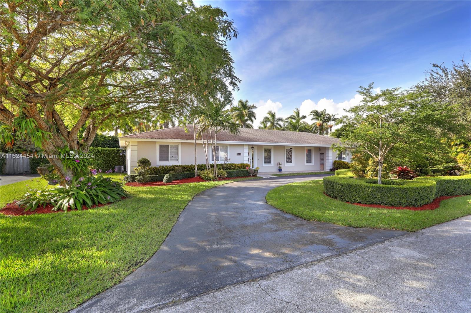 Wonderful, 3 bedroom, 2.5 bathroom home in the heart of Pinecrest, close to schools, restaurants, shopping, and more!  The fantastic layout includes an open living room and dining room with views overlooking the covered patio and pool, nicely-renovated kitchen with breakfast room, plus family room/office.  The primary suite includes two closets and a well-appointed bathroom with two sinks, two additional bedrooms share a large, updated bathroom.  Outside find a summer kitchen on the deep porch, pool, basketball court, and beautiful green spaces.