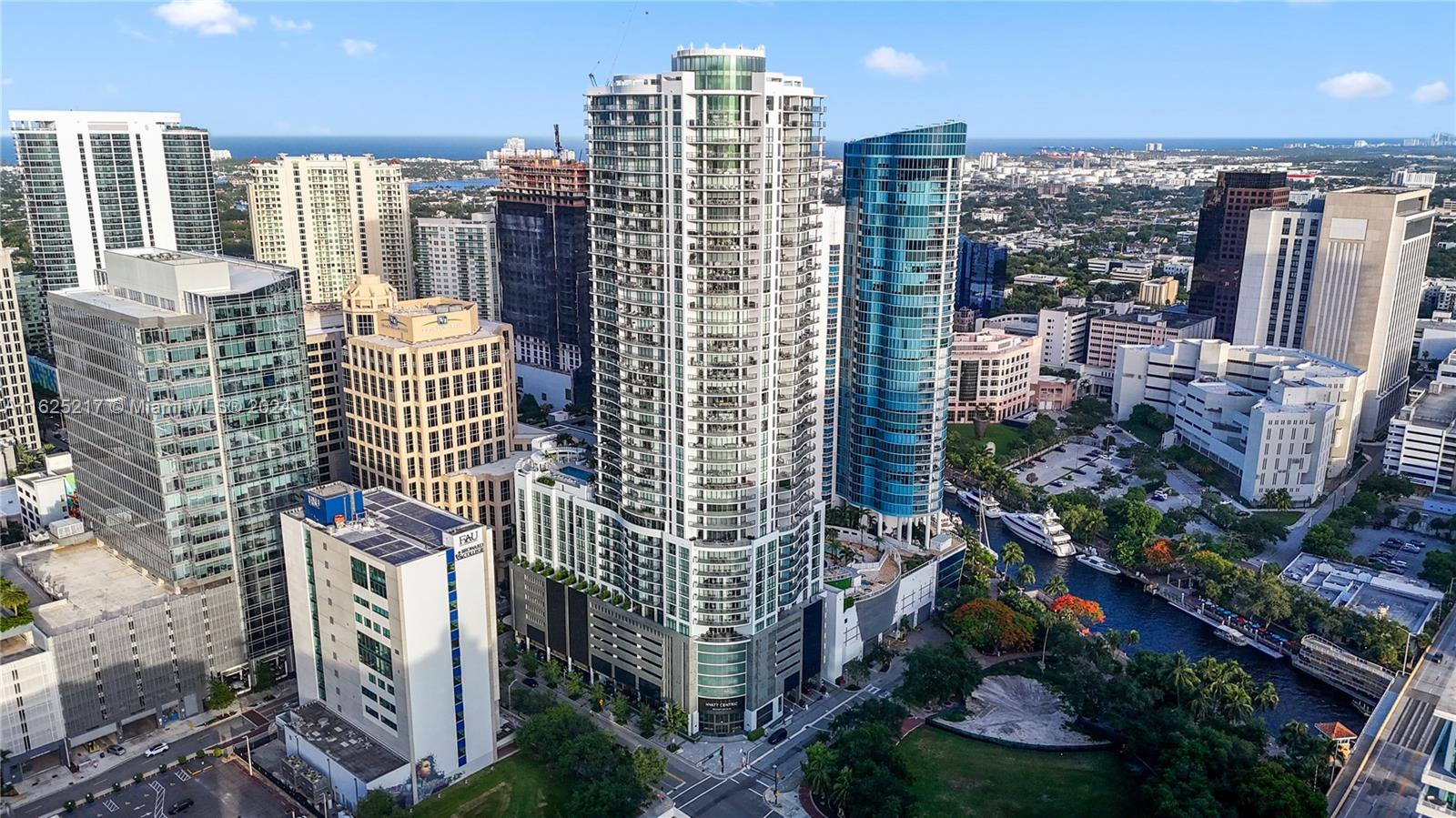 Experience opulent downtown Las Olas living w/ breathtaking skyline views in this sophisticated urban sanctuary. Featuring a sprawling open flrplan, bespoke built-ins, 3 beds + den/office, 3.5 baths, 2 expansive terraces, laundry rm, & 2.5 parking spaces. The kitchen boasts lux Nolte Euro Italian cabinetry, pristine white quartz cntrtops, & ultra modern Jenn-Air applcs. Revel in floor-to-ceiling impact windows, auto shades, porcelain tile flrs, & custom-designed closets & baths. Enjoy stunning sunsets & sweeping river, city, park, & ocean views from huge wraparound balcony. Towering 46 stories high, this pinnacle of luxury offers valet, internet, concierge, 24/7 security, resort pool, private cabanas, grills, dual lounges, & fitness center. Discover unparalleled urban living at its finest.