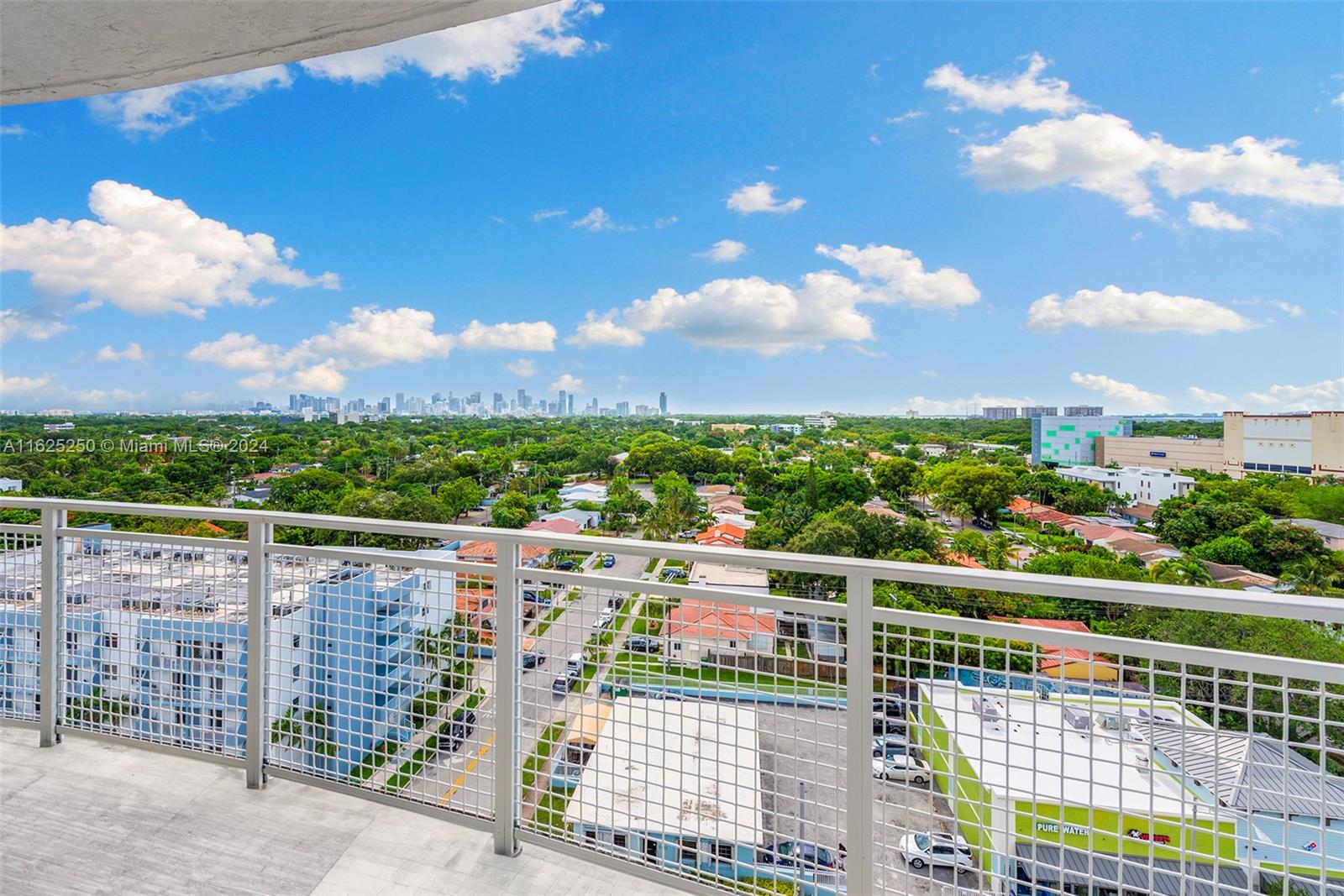 Stunning Miami skyline and ocean views from this 2 bed / 2 bath penthouse with oversized balcony and high ceilings throughout. Enjoy the Coconut Grove lifestyle atop this boutique condominium, Gateway to the Grove. With a comfortable split floorplan and open kitchen, this penthouse is now rarely available and move-in ready. Ideally located 2 blocks from the brand-new Grove Central Shops, which include Target, Sprouts Farmers Market, Total Wine, Five Below, Chipotle, Panera Bread, the famous luxury gym Club Studio and more. Residents will also appreciate easy walking access to Metrorail and the new Underline linear park. Gateway to the Grove amenities include a gym, social area, dog-friendly spaces, and an indoor heated pool. Two deeded parking spaces ensure convenience for you and guests.