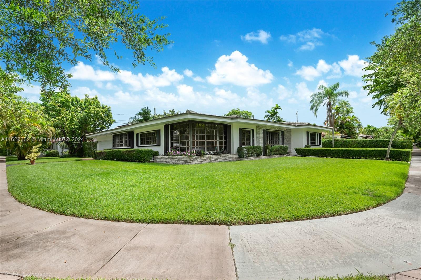 Discover the perfect home on a spacious 13,000 sq. ft. corner lot in a prime Coral Gables location. This charming residence boasts 3 bedrooms and 2 bathrooms, with 2 car garage ideal for family living. A generous family room, living room, formal dining room, eat in kitchen, and an additional sunroom offer versatile spaces for entertainment, work, or relaxation. The oversized lot provides ample outdoor space, with plenty of room for a pool and landscaping possibilities. Enjoy the convenience and appeal of this well-situated property, offering both comfort and potential for future enhancements. This is a rare opportunity to own a large corner lot in a desirable area, combining both indoor and outdoor living at its finest. Don’t miss your chance to make this exceptional property your home.