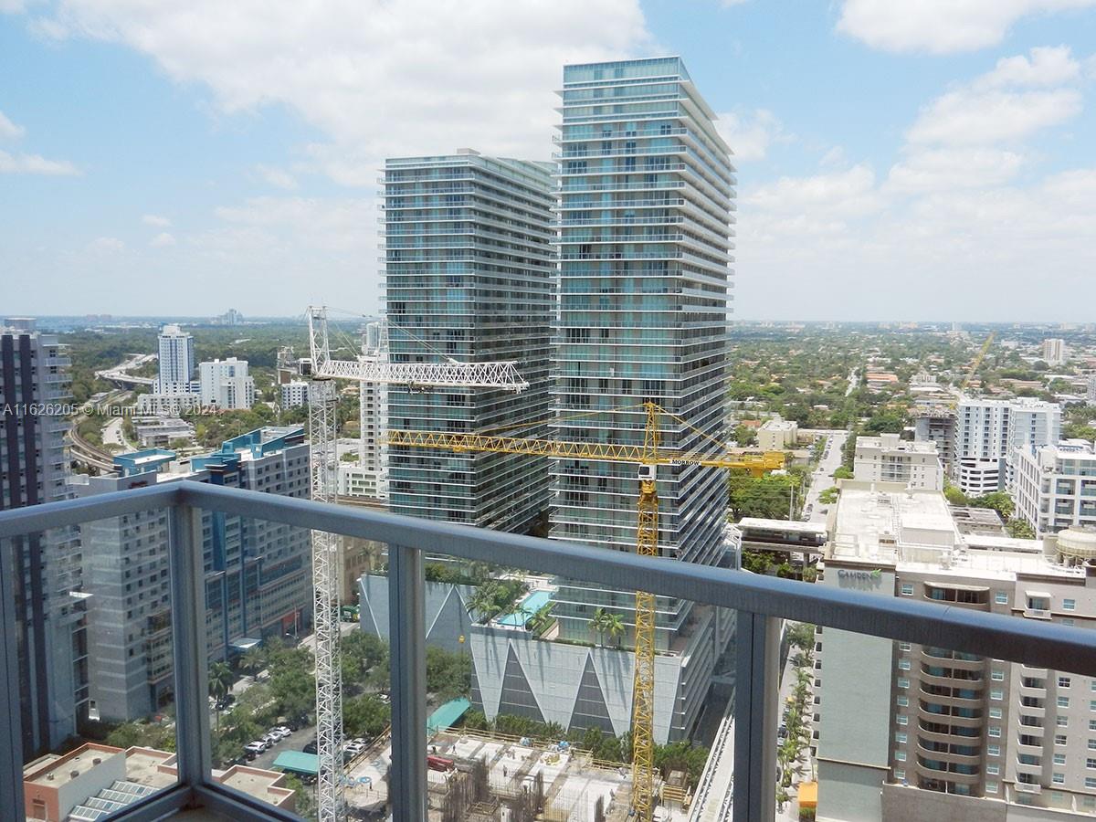 Experience the ultimate in luxury living on the 26th floor of 1050 Brickell, one of Miami's most prestigious addresses. This stunning 2 bedroom plus den/2.5 bathroom residence boasts breathtaking views of the city skyline and Biscayne Bay from its expansive windows and balconies. The sleek modern design and sophisticated finishes are complemented by the building's world-class amenities, including a rooftop pool, state-of-the-art fitness center, and concierge service. Enjoy the privacy and security of a high-floor residence with unparalleled views, perfect for watching the sunset over the city. Don't miss out on this rare opportunity to own a piece of Miami's sky