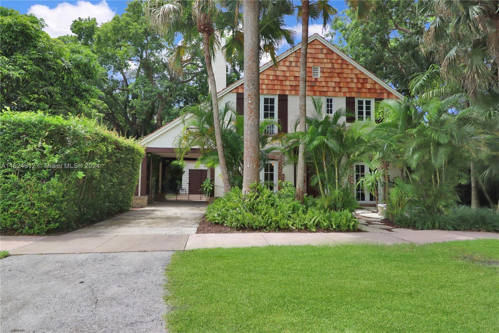 Step into history with this enchanting 1926 landmark gingerbread home, your gateway to the coveted Gables lifestyle. This architectural gem seamlessly blends vintage appeal with modern comforts. Discover a spacious layout featuring an updated kitchen adorned with sleek quartz countertops. Impact windows throughout ensure peace of mind. The living room showcases elegant tile flooring, while warm wood floors grace the bedrooms. Multiple flex spaces offer endless possibilities to tailor your living experience. Outdoors, a generous yard awaits your vision - perfect for adding a pool or future expansions. Embrace the freedom to create your oasis. Ideally located, enjoy easy access to the heart of Coral Gables, the vibrant Grove, and charming South Miami.