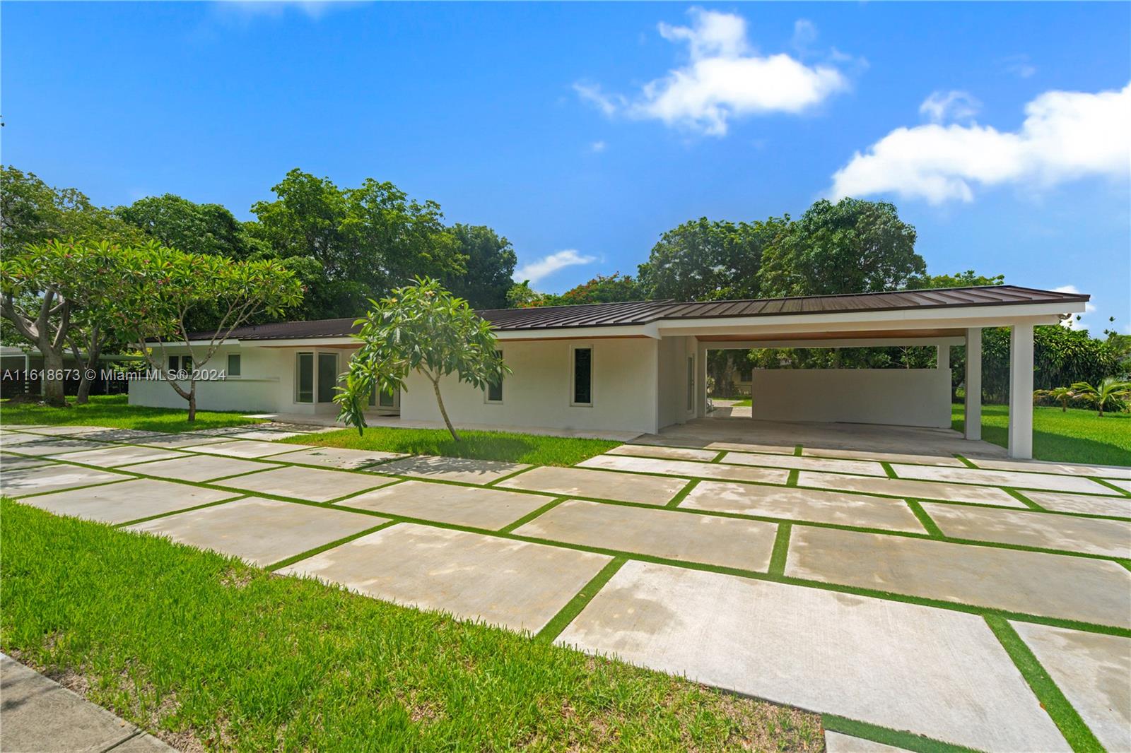 Stunning, Updated Canal-Front Home in Pinecrest. Experience luxury living in this beautifully renovated home. Exceptional curb appeal & meticulous updates, this property offers the perfect blend of elegance and modern convenience. Situated in a highly sought-after neighborhood, offering serene canal views. Featuring exquisite porcelain tile flooring throughout, brand-new kitchen w/ top-of-the-line appliances & fully renovated bathrooms. Open floor plan that is perfect for entertaining. The impact doors & windows provide superior security & energy efficiency. Also featuring a 2-car carport w/ a circular driveway. Don't miss the opportunity to live in this exceptional home, offering unparalleled luxury and comfort in Pinecrest. Perfectly priced, this rental offers everything you need & more