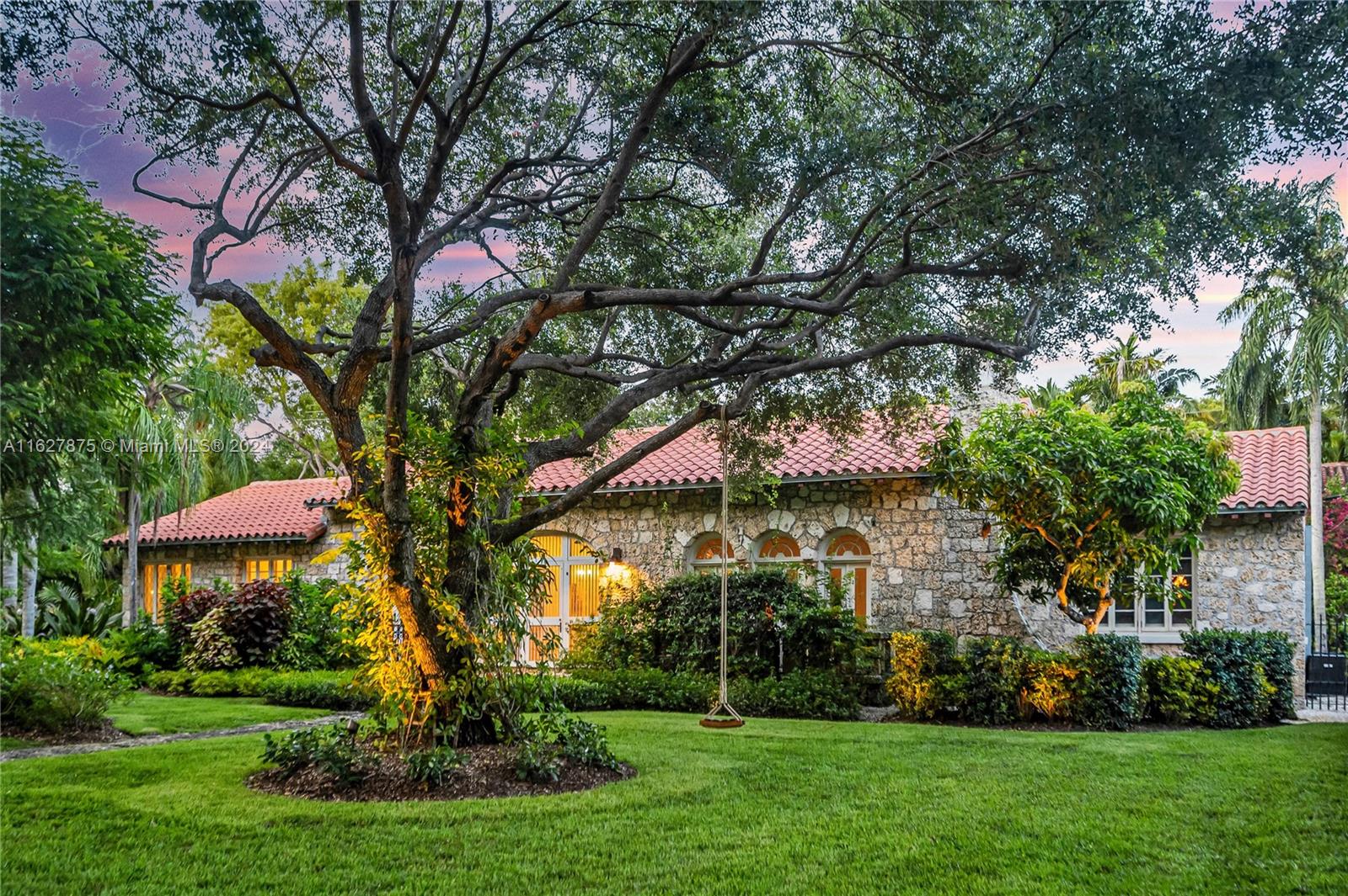 Fall in love with "Casa Roca" one of 27 Coral Rock homes designed by H. George Fink in our City Beautiful. Appointed on the most prestigious tree canopied street, surrounded by fellow historic & iconic architecture. While preserving the romance & enchantment of the 1920's minimalism, this home has been re-introduced to modern luxury. Greeted by a captivating Spanish Loggia entrance, enjoy soaring ceilings, exposed wood beams, natural oak floors throughout the living spaces & gorgeous Porcelanosa tile in the fully remastered chef inspired kitchen. Cozy up by the fireplace where the abundance of natural light pours in like a lullaby. Bathrooms have been redesigned providing a seamless marriage of traditional & modern. Plus 2-car temperature-controlled garage. Over $1mm + in renovations!