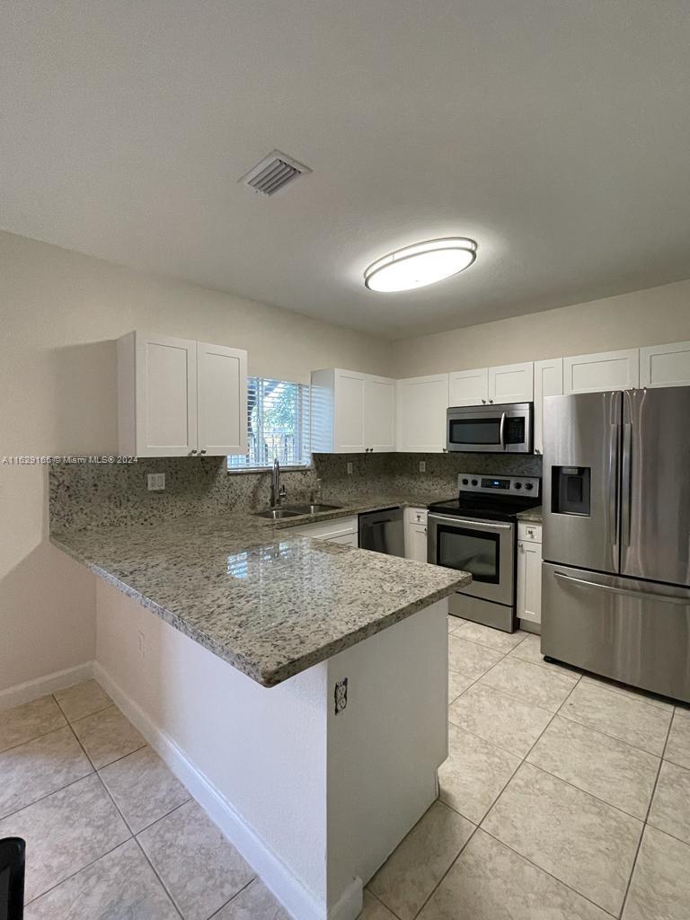 Cozy townhouse with lake views in Cutler Bay. Freshly painted and recently renovated, very clean. Features a one car garage with 2 car parking outside. Stainless steel Samsung appliances. Extra built-in pantry, washer and dryer inside the garage. Granite kitchen countertop with sink. Roomy bedrooms with their own bathroom each. Half bath downstairs. Wood stairs and wood floors on the second floor. Tile floors downstairs. Nice walk-in closet in the master bedroom, nice size closet in the second bedroom. Natural light throughout. This townhouse is located in a very nice and gated community, walking distance to elementary and high schools, less than a mile away from supermarket, gas station, pharmacies and much more. Also features a community pool and playground. Close to Florida Turnpike.