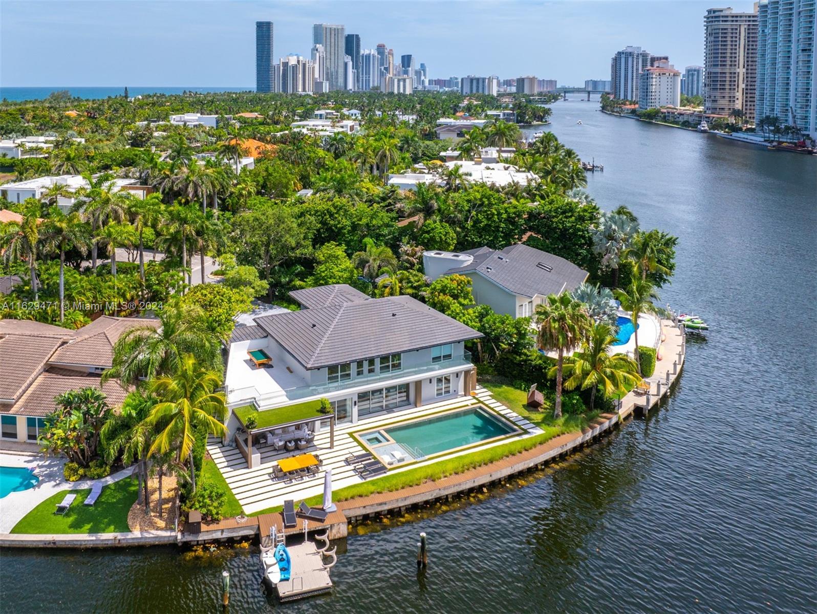 The finest house in prestigious Golden Beach, FL. This turnkey residence epitomizes luxury living, featuring the best views in the neighborhood and 125 feet of waterfront access on the Intracoastal, ideal for boaters seeking to dock a large yacht. Spanning 5,549 square feet, the property boasts five bedrooms, four and a half bathrooms, and an office space, ensuring ample room for living and entertaining. Located at the cul-de-sac on an island with access limited to only 30 mansions, the property offers exceptional privacy. Enjoy the best of coastal living with exclusive access to a private beach just a five-minute walk away, five parks, and sports courts, all within Miami-Dade County's finest residential community. This is a unique opportunity to own a ready to move house that won’t last.