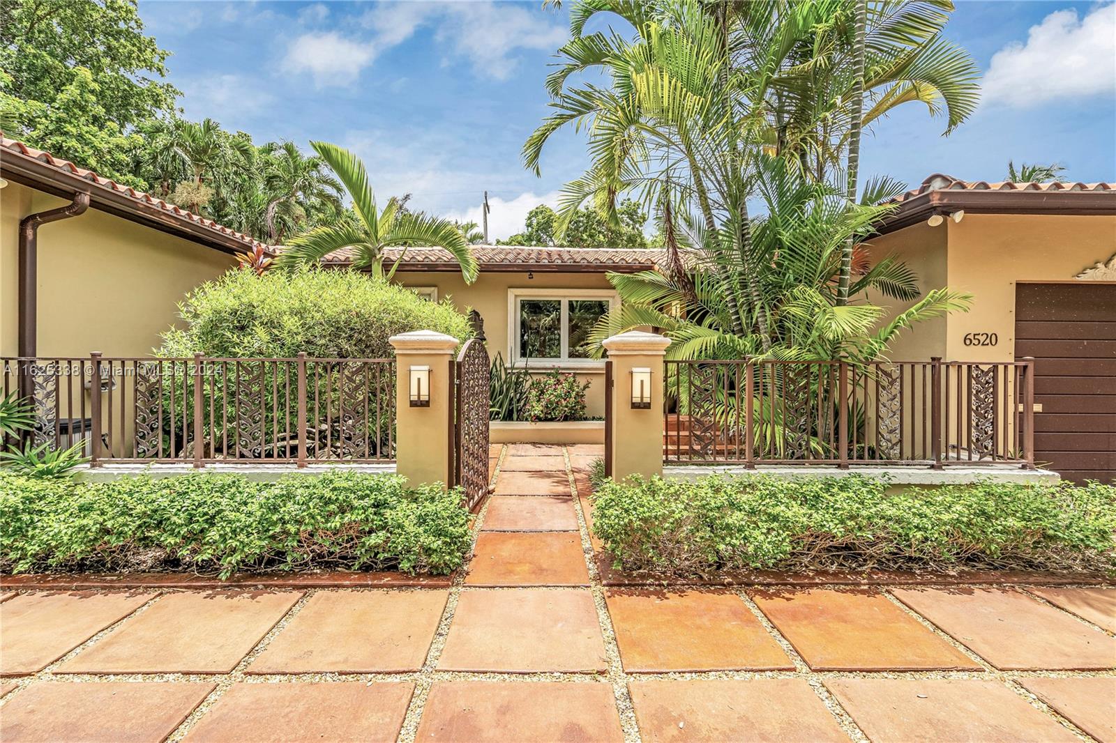 Welcome “Palm Zen Manor” -  An updated & sleek single-family on a double lot in prime south Gables location. This  residence boasts 1,661 sq ft with an open concept design & tons of natural light opening to relaxing garden views throughout. The moment you walk up you are greeted by a koi pond & fountain. When you step inside the home is decked w/ beautiful Oak Wood Floors, a new AC unit, updated plumbing, impact windows & doors, newer kitchen w/ S/S appliances. Spacious bedrooms & primary suite. The meticulously landscaped yard is a serene escape, ideal for relaxing or hosting gatherings & is the ultimate private escape. The home has an expansive deck ready for a possible addition. Covered lenai with sunsetter awning. Room for pool. Minutes from South Miami & Downtown Coral Gables.