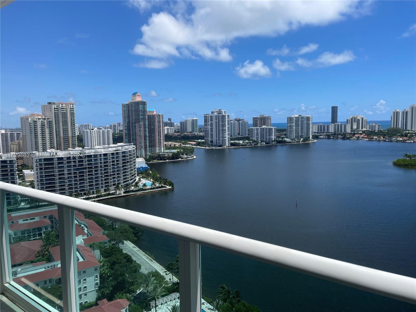 Endless water views from the 24th floor at the newly renovated Peninsula II, Luxury at its finest! Very spacious with 3 bedrooms + DEN & 3.5 baths, over 3,000 sq ft of bliss! Two balconies with gorgeous views of the intracoastal & city. Marble floors throughout and completely decorated & equipped with all the furniture included in the sale**Big Utility room with full size washer & dryer and walk-in closets throughout. ** One large Storage unit + 2 deeded garage parking spaces included** Peninsula II is a full service building with 24 hr security, concierge & valet. State of the art amenities including spa, sauna, fitness center, children's playroom, Tennis courts, BBQ and 2 pools for your enjoyment. Live like you're on vacation every day of your life, schedule your tour today!