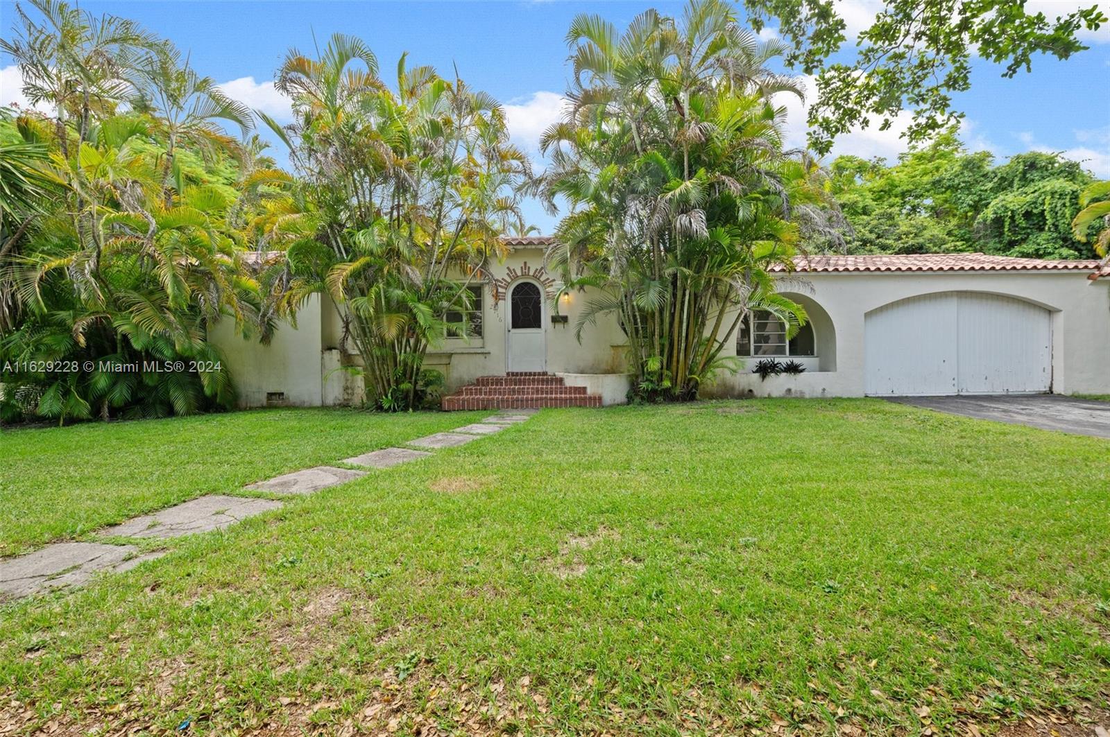 3 Bed/2 Bath home in prime Coral Gables location! Property is on a spacious 11,250 Sq Ft Lot within minutes of Venetian Pool, Biltmore Hotel and Miracle Mile. House needs updating but has good bones & ample room to expand and add a pool. Living Room features an Art Deco fireplace, a vaulted 10 ft.+wood ceiling & is subdivided by columns providing space for separate seating or informal dining. There is a library off the Living Room with built in bookshelves and another large room that can serve as a formal Dining Room. 2 Bedrooms and a bath complete the main living quarters. A separate room & bath on the other side of the garage has its own entrance & may be used as a home office or additional bedroom for guests. House is offered "As is".