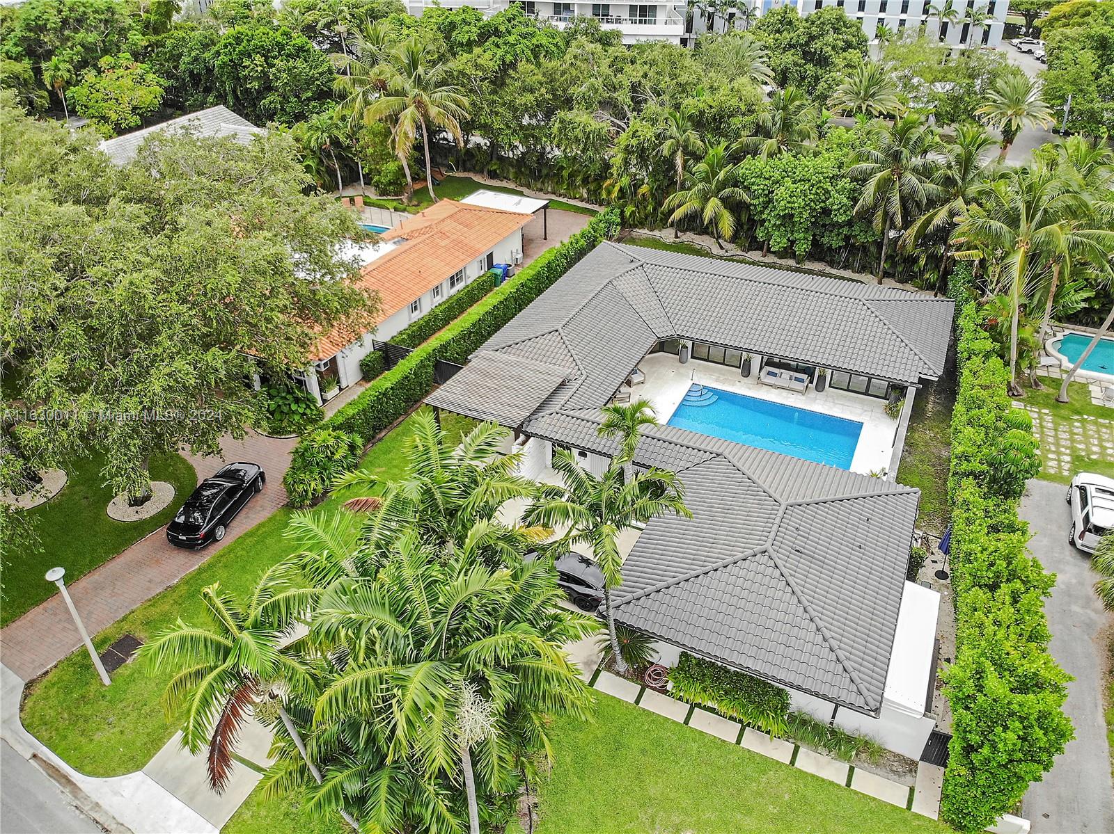 Located in one of the most coveted guard-gated communities in Miami, this Bay Point home was fully remodeled in 2019. Its U-shaped design allows for tons of natural light as all rooms open to a center courtyard featuring a beautiful mosaic pool and outdoor kitchen. Upon entry, you are greeted by a custom Italian kitchen and an open living/dining area with wide-plank wood floors that flow throughout the home and into its 4 bedrooms, 2 of which are ensuite. There are 3 additional full bathrooms, a laundry room and storage room/service quarters. The rear of the home has a deck and spacious yard surrounded by mature trees. Located within short distances to the Cushman School, the Miami Design District, Midtown Miami, Wynwood, Miami International Airport and Miami Beach. Tax record shows 2667SF