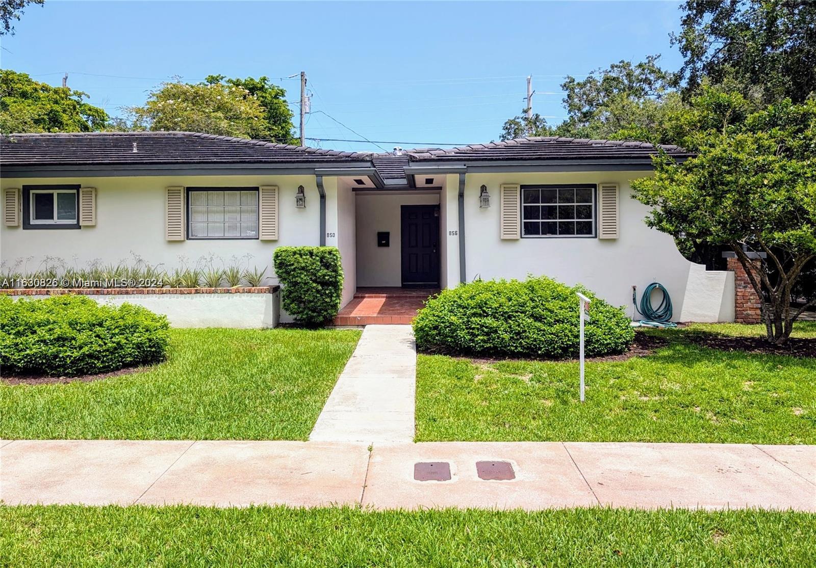 Spacious, bright 3/2 Coral Gables duplex that feels like a single-family home, steps from University of Miami and Metrorail. Expansive living and dining room area opens to screened porch. Recently renovated kitchen with granite countertops, new cabinetry & appliances. Primary bedroom with en-suite bathroom, walk-in closet, and sliding doors to porch. Additional 2 bedrooms have large closets and share fully renovated bathroom with double sinks and shower. In-unit stacked washer & dryer. Tile floors throughout. Screened porch allows for outdoor enjoyment without the mosquitos! Assigned parking space in rear, additional street parking available. Perfect for a family or 3-4 students. Available for immediate occupancy - move in before classes start! Call listing agent for showing.