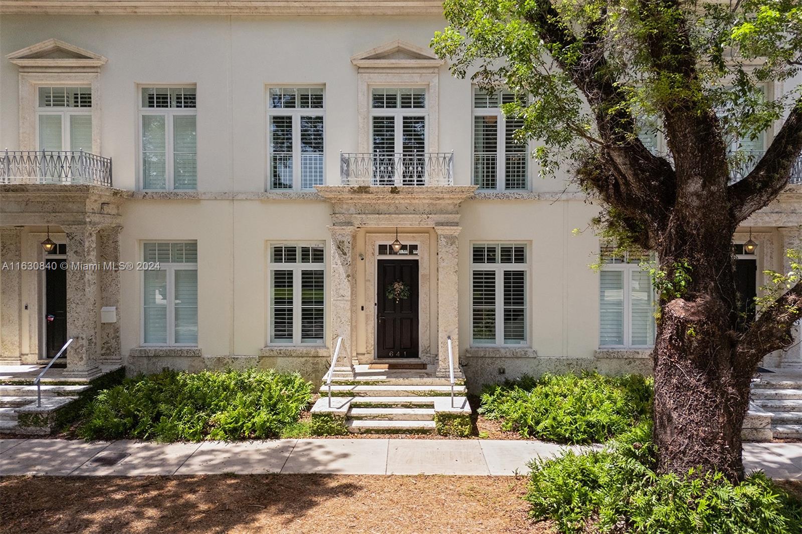 Welcome to this exquisite townhome in Coral Gables. Upon entering, you're welcomed by high ceilings, a cozy family room, and natural oak wood floors. The kitchen boasts state-of-the-art Wolf and SubZero appliances complemented by elegant marble countertops. Ascend the staircase to the primary ste, where you'll discover a spacious walk-in closet and a luxurious bathroom designed for ultimate comfort. Another generously sized bedroom on this level features its own private bathroom and a large closet. Step outside to the courtyard, showcasing a covered terrace and a charming fountain. Stairs from the courtyard lead to two additional en-suites, offering privacy and comfort. Additionally, this home features a two-car garage for your convenience and is located near Miracle Mile.