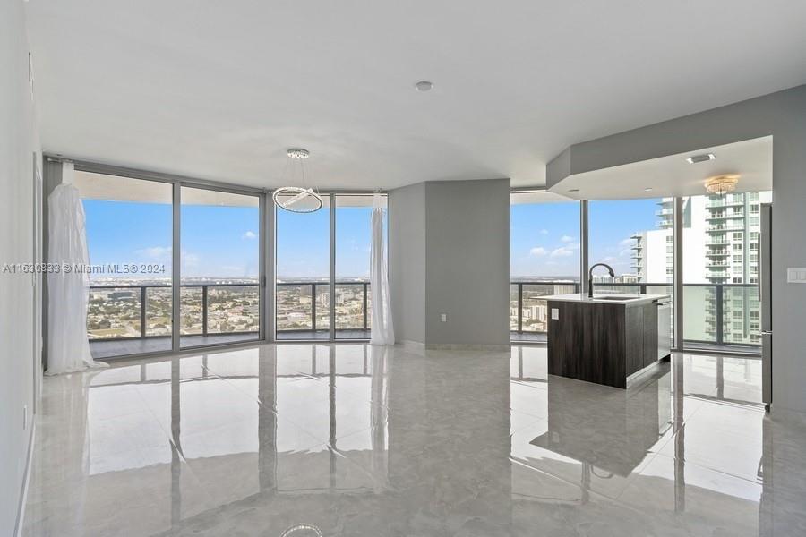 Edgewater is one of the most desirable areas along the Bayfront in the Arts & Entertainment District. Custom finished 2 Beds, 2.5 Baths + 2 GARAGE PARKING SPACES. Direct NW corner views of Miami City skyline & some bay! Residence has 1,312 sf + large 348 sf wraparound balcony, quartz countertops, beautiful floors, kitchen=Bosch appliances, marble tiled backsplash & island. Bathrooms upgraded with marble backsplash, glass shower doors, shampoo nooks, lighted color changing mirrors & towel warmers. Master bath with double sinks with separate tub/shower. Aria is new full-service building with outdoor pools & jacuzzi, social areas, BBQ’s, gym, spa, sauna, steam room, kids play rm & social rm, theatre room, sun deck, yoga studio & more. This gorgeous home is being offered for an annual rental.
