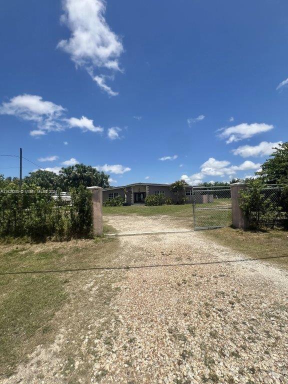 Welcome to this unique opportunity in the desirable Homestead area (Folio 30 Miami-Dade). Spanning over 3 acres, this property boasts a charming 3-bedroom, 2-bathroom home with 1,790 sq ft of living space and a refreshing pool. Nestled within the Urban Development Boundary (UDB), the property also features a productive lychee farm, adding a touch of agricultural charm. Additionally, there is a mobile home located in the back corner of the property with occupants. This property presents a possible development opportunity, offering immense potential for the right investor. Please note, the property is being sold occupied and sight unseen. Property is being sold via auction from July 29th-July 31stl