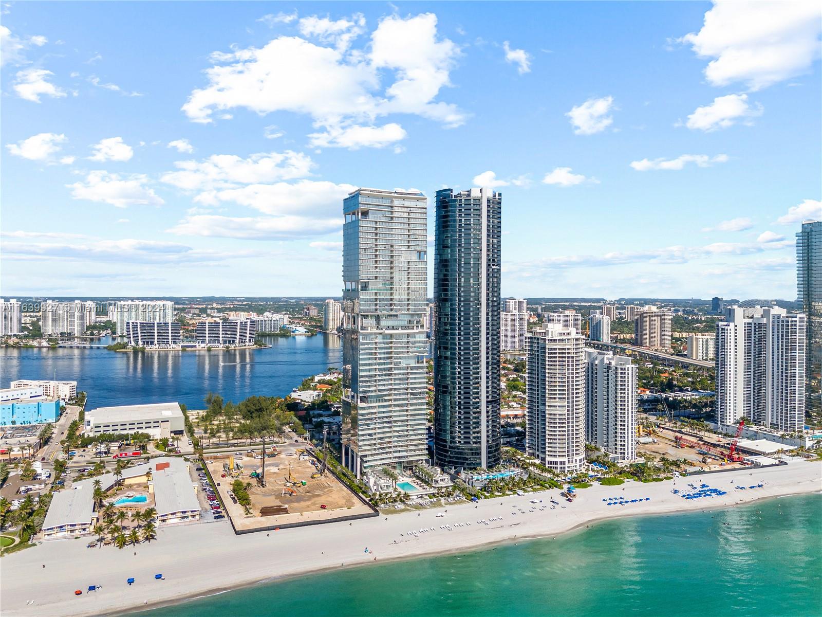 Experience unparalleled luxury in this exquisite residence at Turnberry Ocean Club, Sunny Isles. Unit 2603 offers a sophisticated lifestyle with over 70,000 SF of world-class amenities across three dedicated levels. Upon entering your private foyer, you’ll be greeted by opulent marble floors, top-of-the-line Dornbracht fixtures, and exquisite designer lighting. This 3-bedroom, 4.5-bathroom home features a versatile den/staff quarters, soaring ceilings, expansive glass impact doors and windows, a summer kitchen, and top-of-the-line Gaggenau® appliances. Enjoy mesmerizing oceanfront sunrises and sunsets from your terrace, with captivating views of the Intracoastal Waterway.