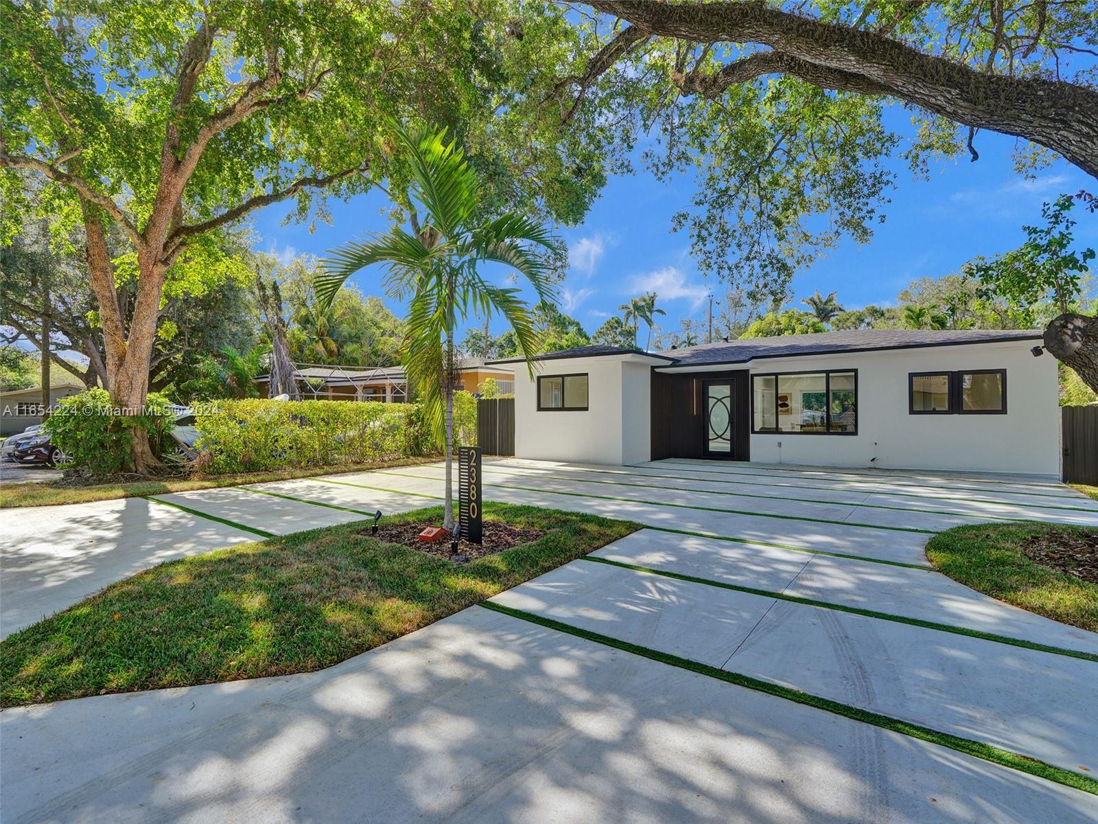 SELLER MOTIVATED, BRING OFFERS!! Step in this custom-designed contemporary luxury home in the exclusive Ojus area, just 7 mins from Aventura Mall and 9 mins from the beaches. Enjoy a tranquil & accessible neighborhood close to synagogues, schools, dining, shopping, and beaches, with quick, traffic-free highway access. This modern estate spans 1,477 sq ft on a 6,000 sq ft lot. It features an open layout w/ contemporary tiles, a U-shaped kitchen w/ a waterfall countertop and new appliances, a master suite w/ walk in closet, large showers w/ floating cabinets&mirrors. The interior includes a modern Bluetooth speaker system, controllable throughout the property, allowing to enjoy your preferred music. Tropical landscaping, grass-striped driveway, & a secure aluminum fencing