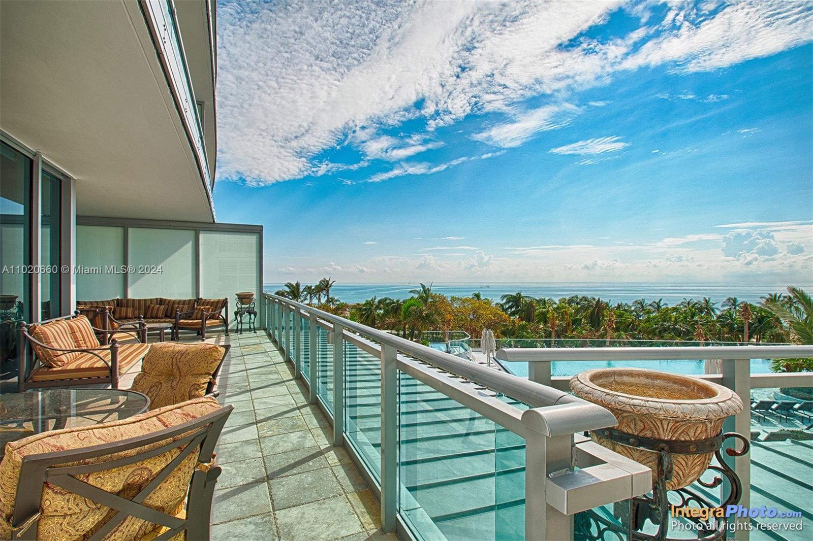 OVERSIZED WRAP AROUND TERRACE WITH PANORAMIC OCEAN, POOL AND TROPICAL VIEW.