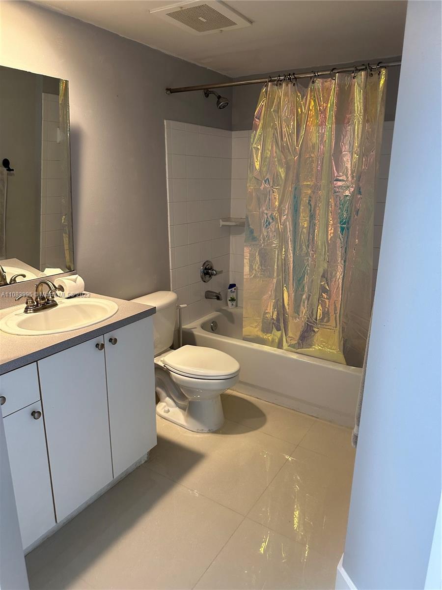 Second bathroom with tub and shower