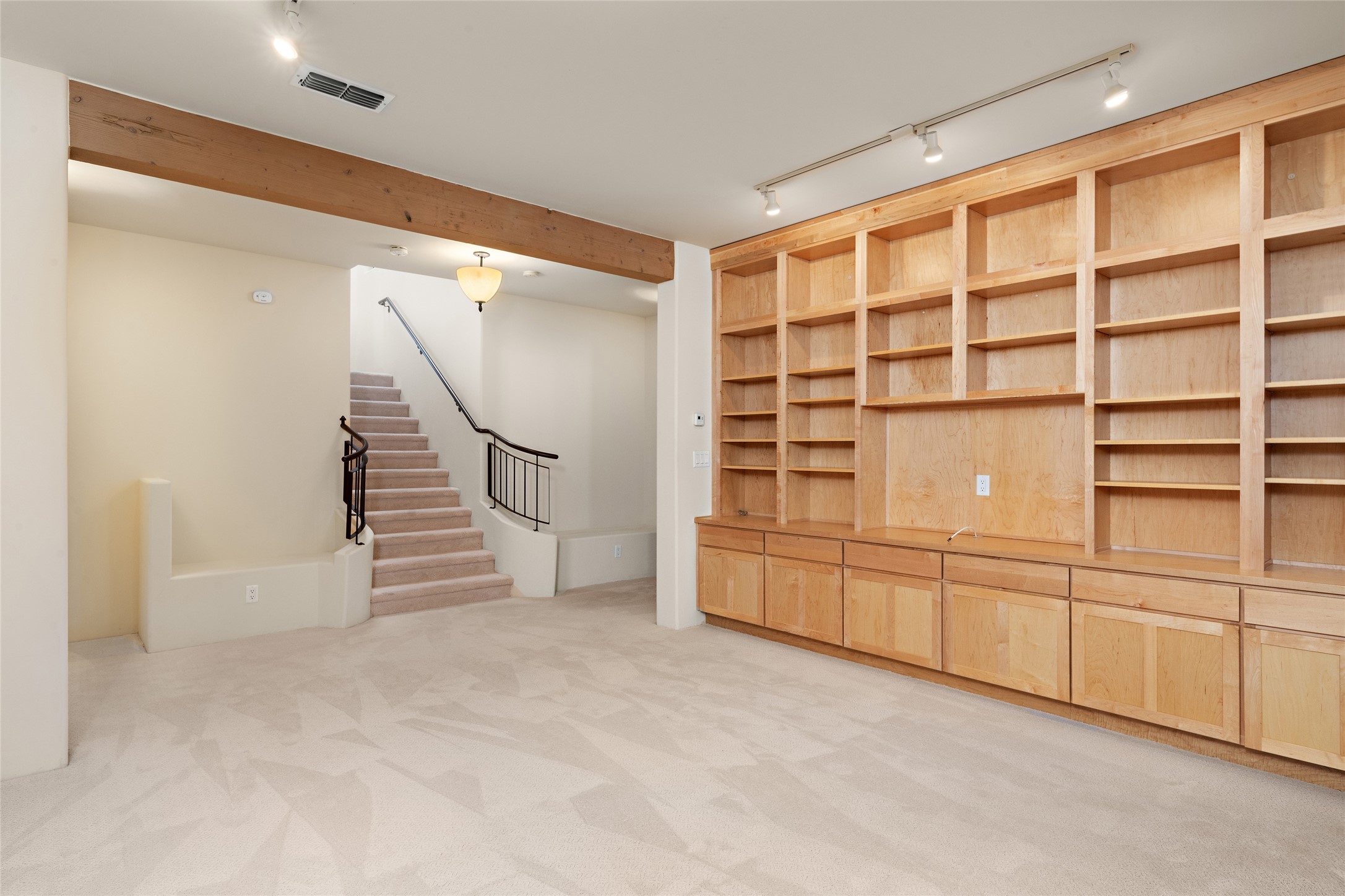 Beautiful down stairs room (Den, TV, Office or flex room downstairs) with build in bookcases