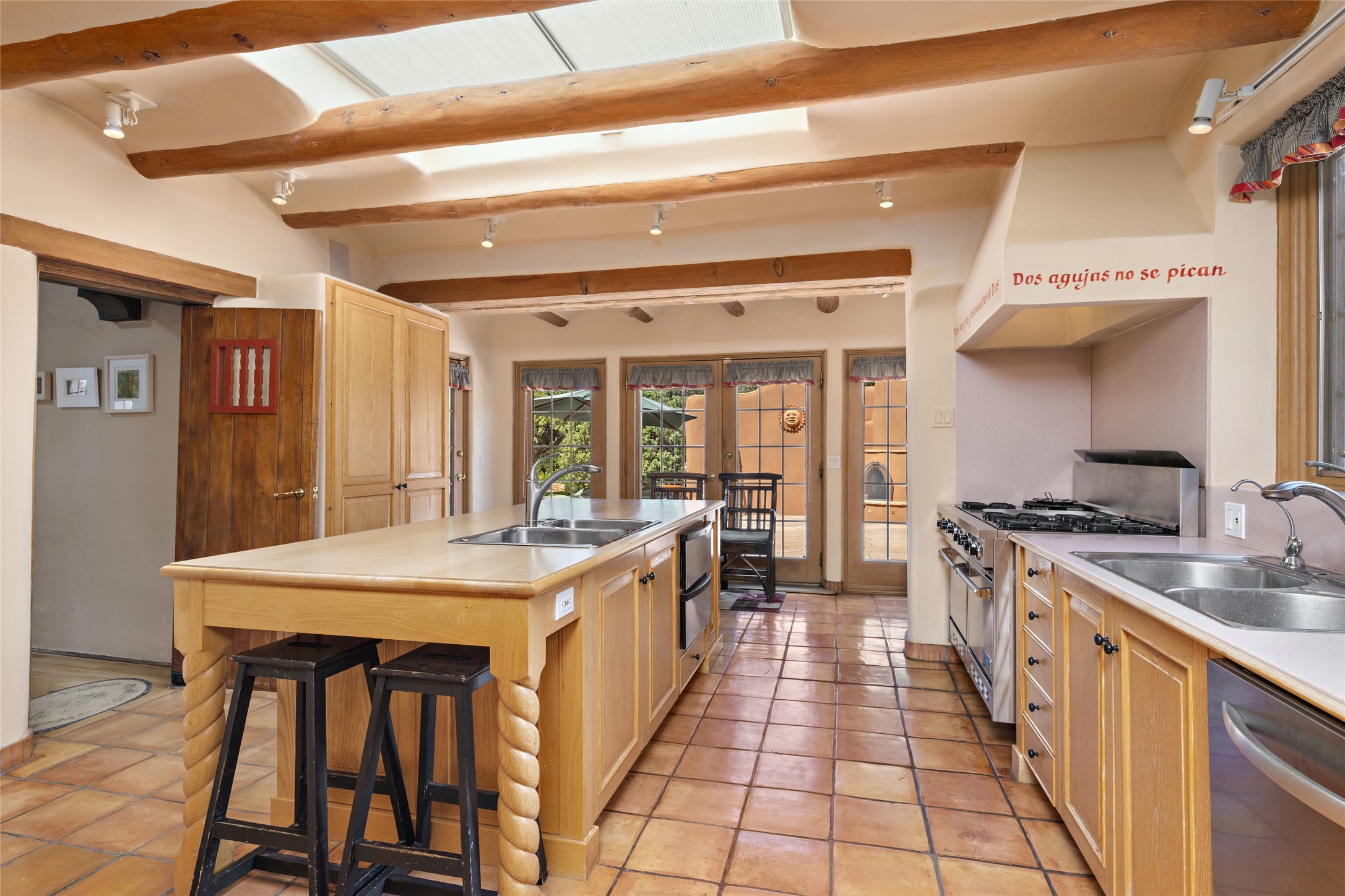 Main house kitchen with wood island and Viking range