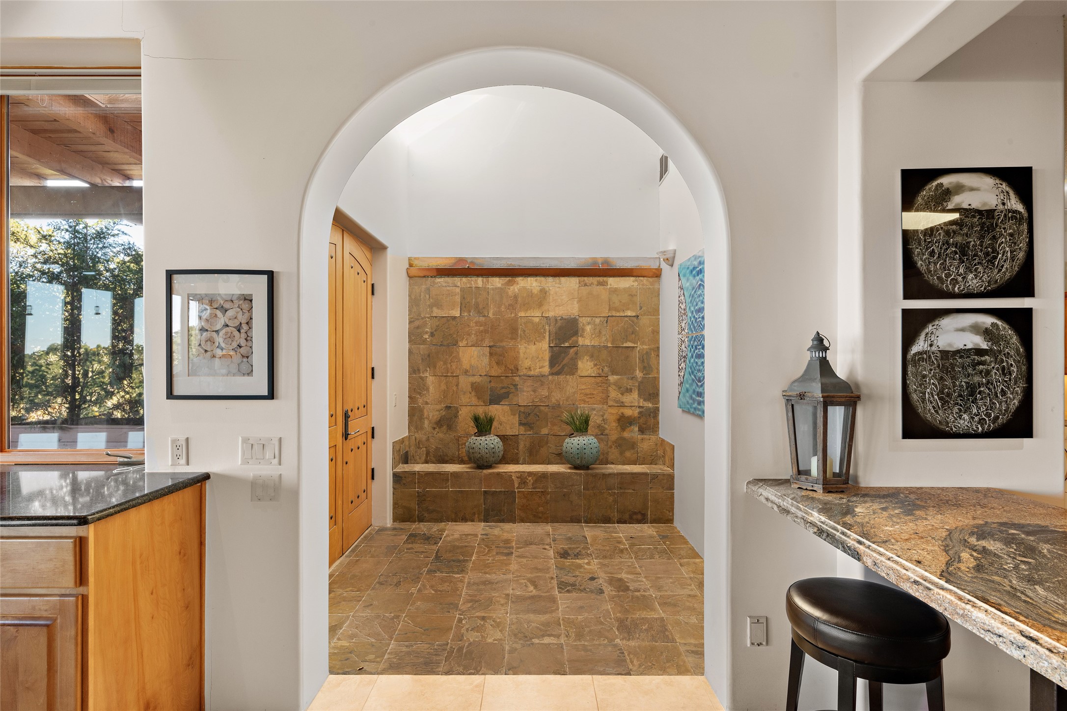 Arched Entry Way, Decorative Slate Features, Brightened Up with Skylight