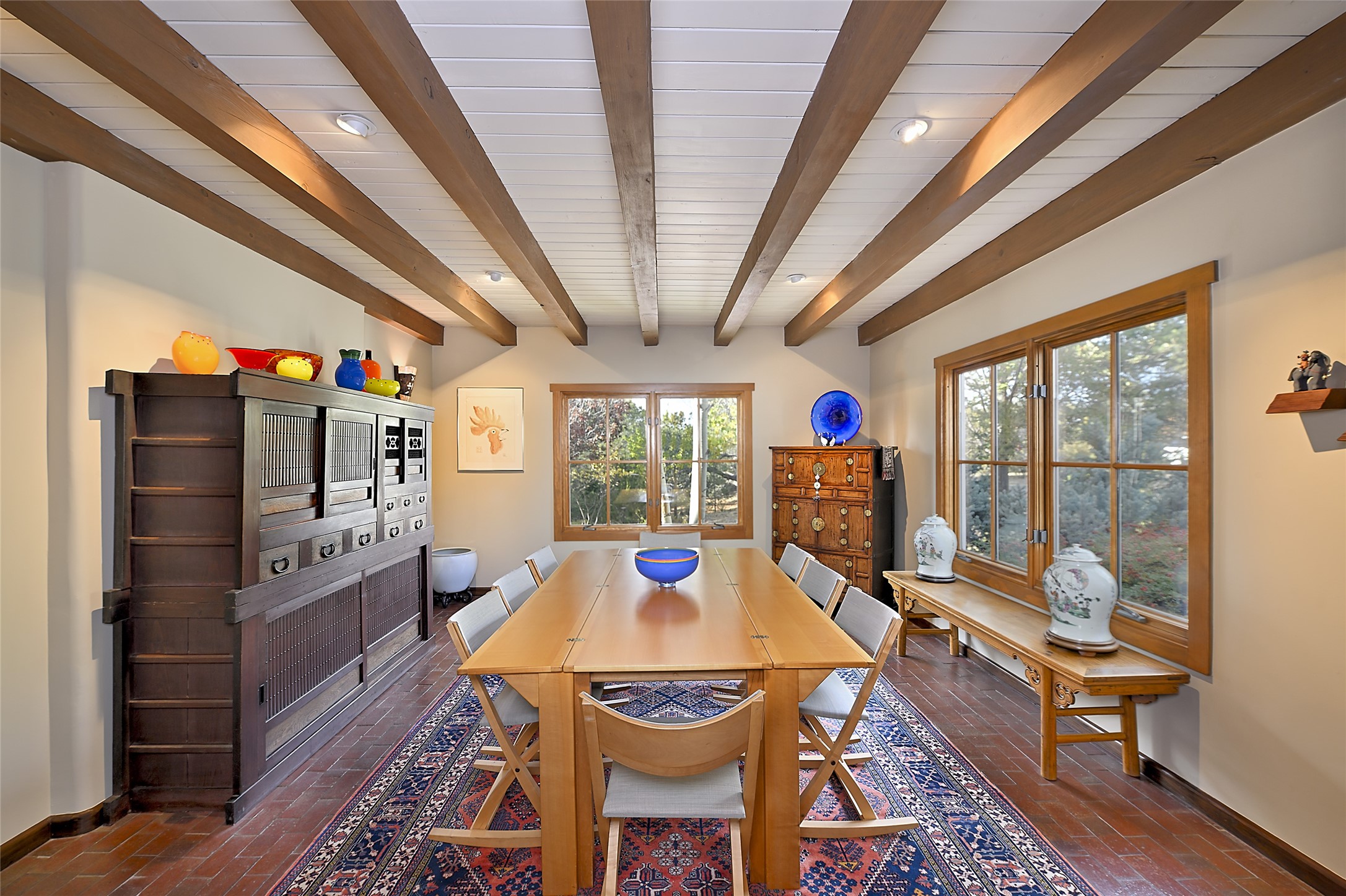 Light-Filled Dining Room w/  2 sets of windowsFireplace plus wood beam ceiling