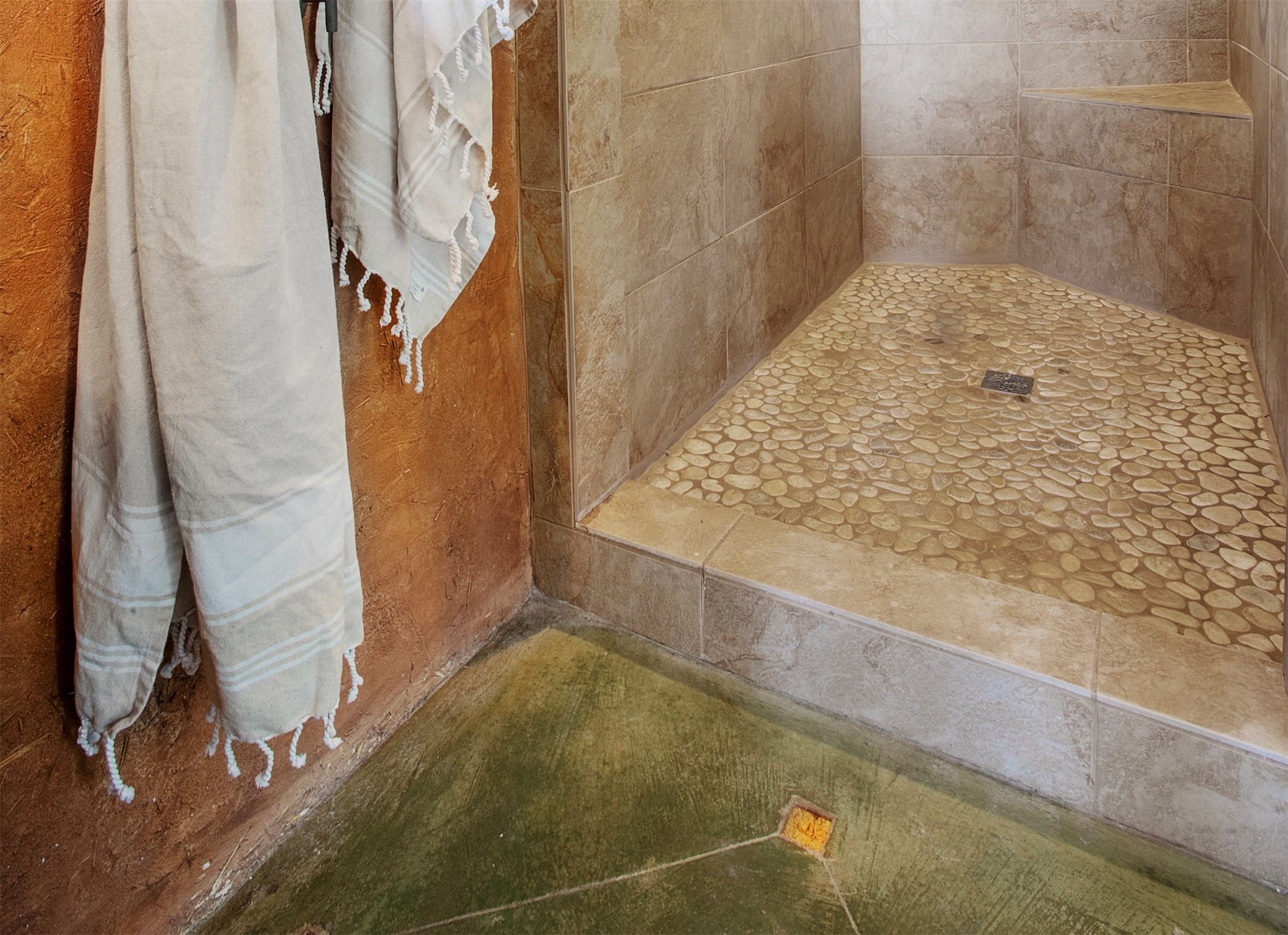 Master bathroom shower tile and floor stain detail.
