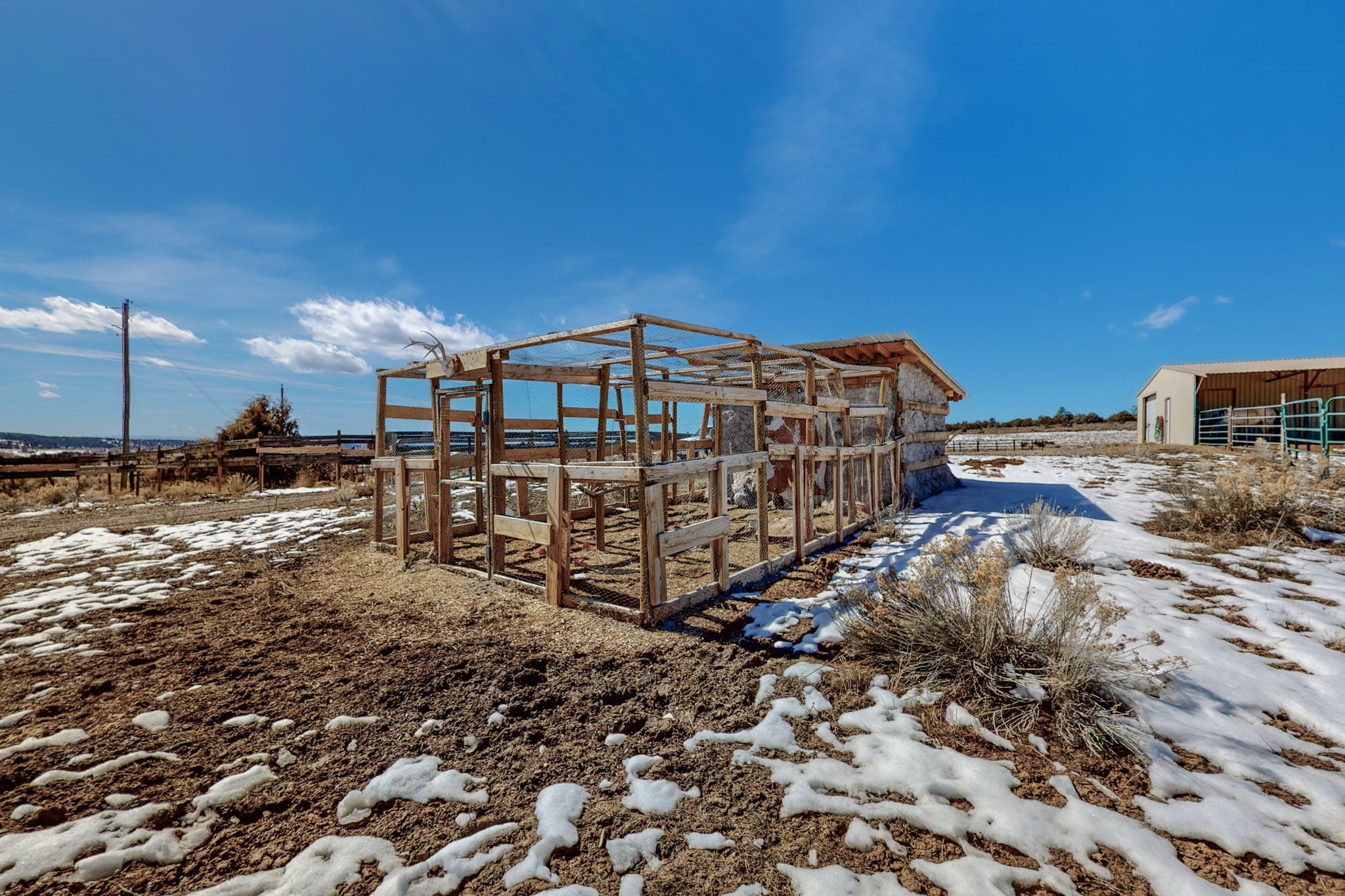 CHICKEN ACCOMMODATIONS
 Just down from the upper pole barn, is a newly installed custom adobe chicken coop. The inside enclosure is 12x14 with a fully closing door,  for heat or cool, as well as a 20X14 foot outside coop enclosure ready to hold up to 25 chickens.