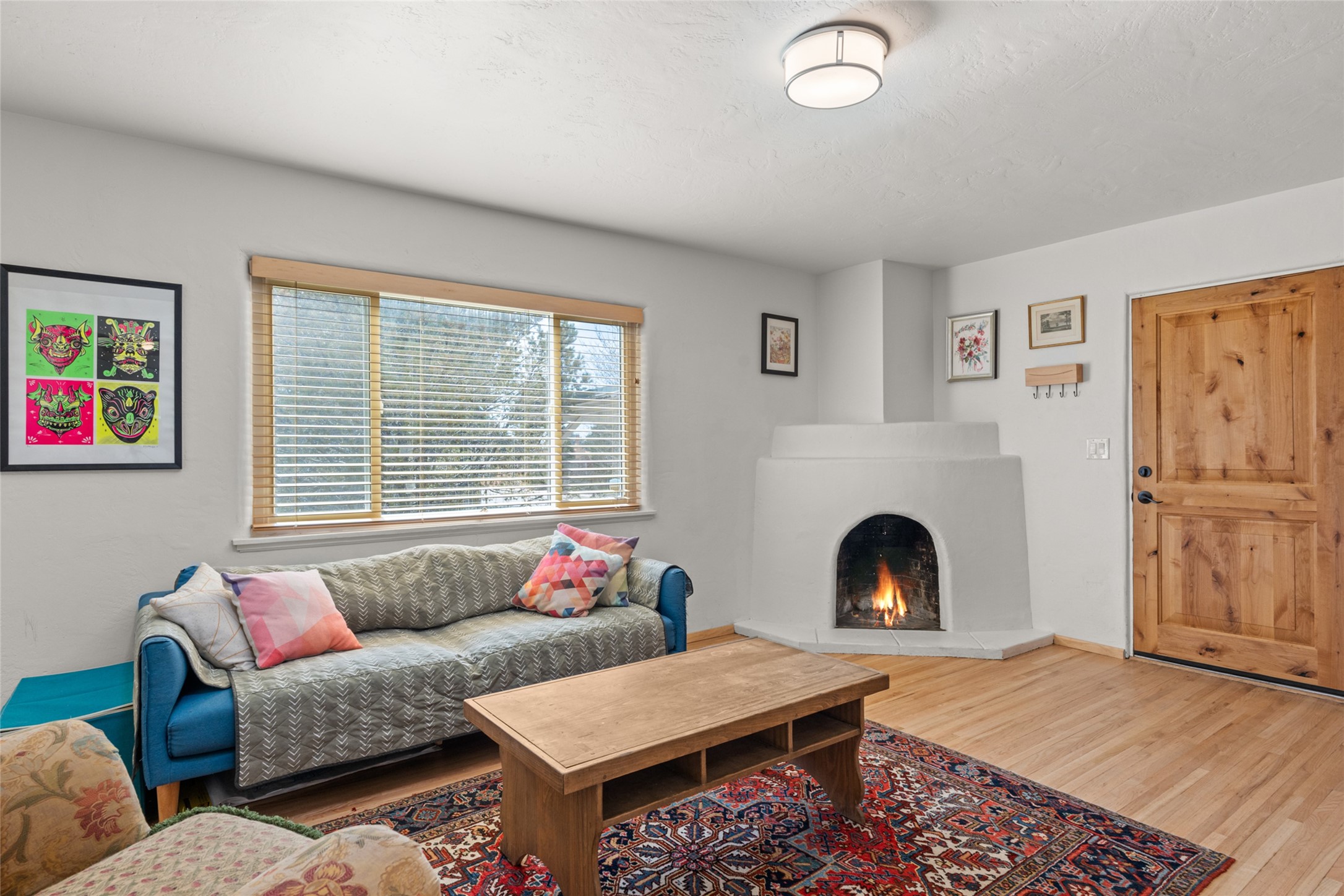 Living Room w/ Corner Kiva Fireplace